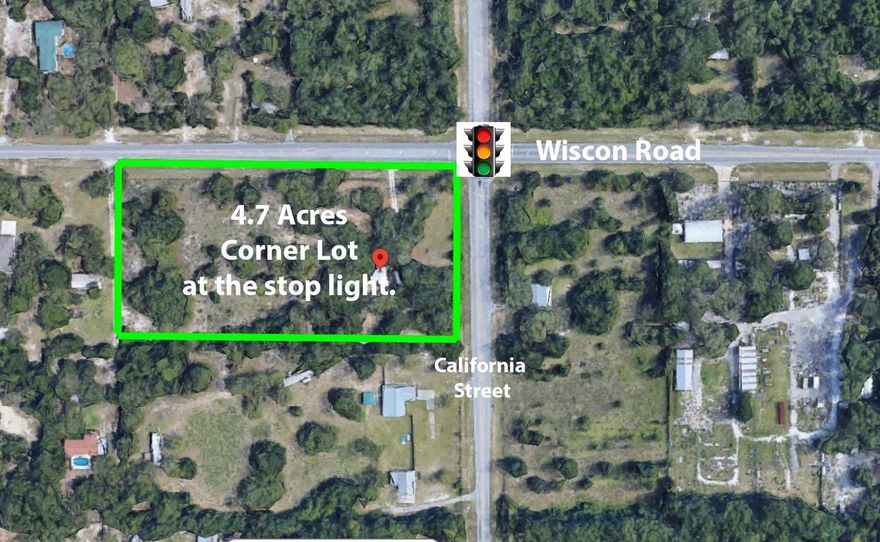 4.7 ACRES at the SW Corner of the stoplight at Wiscon and California Street!! 952 feet of road frontage! Prime development location with this being at the stoplight and near Tampa General Hospital! Should be able to be rezoned to commercial being at the stoplight. This is a growing area with Tampa General and Leyland Preserve Community being built next to TGH. The sale is made of of 2 parcels (Parcel Key 1006681 which is 2.3 acres AND Parcel Key 1006707 which is 2.4 acres).  Parcel 1006681 currently has an older mobile home with well, septic, and residential impact fees paid. Both lots are currently zoned AR2.  Great location for a gas station, convenience store, medical office, dollar store, etc.