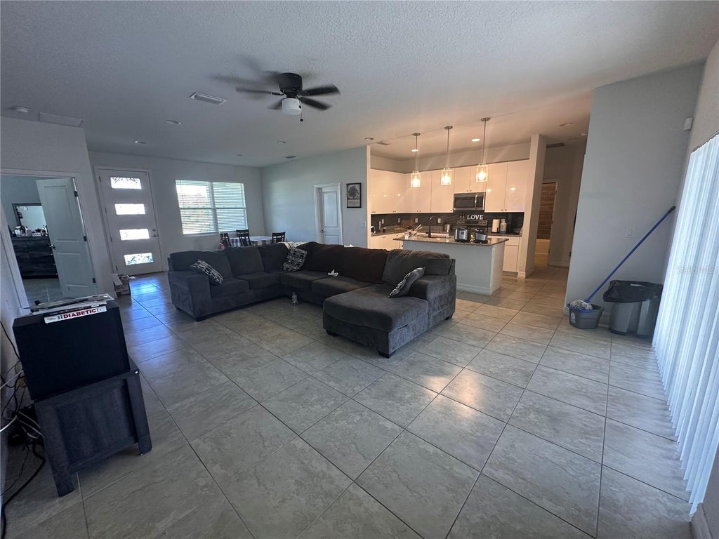Photo of 40 Orchid Lane, Poinciana, FL 34759 (MLS # A4708117)