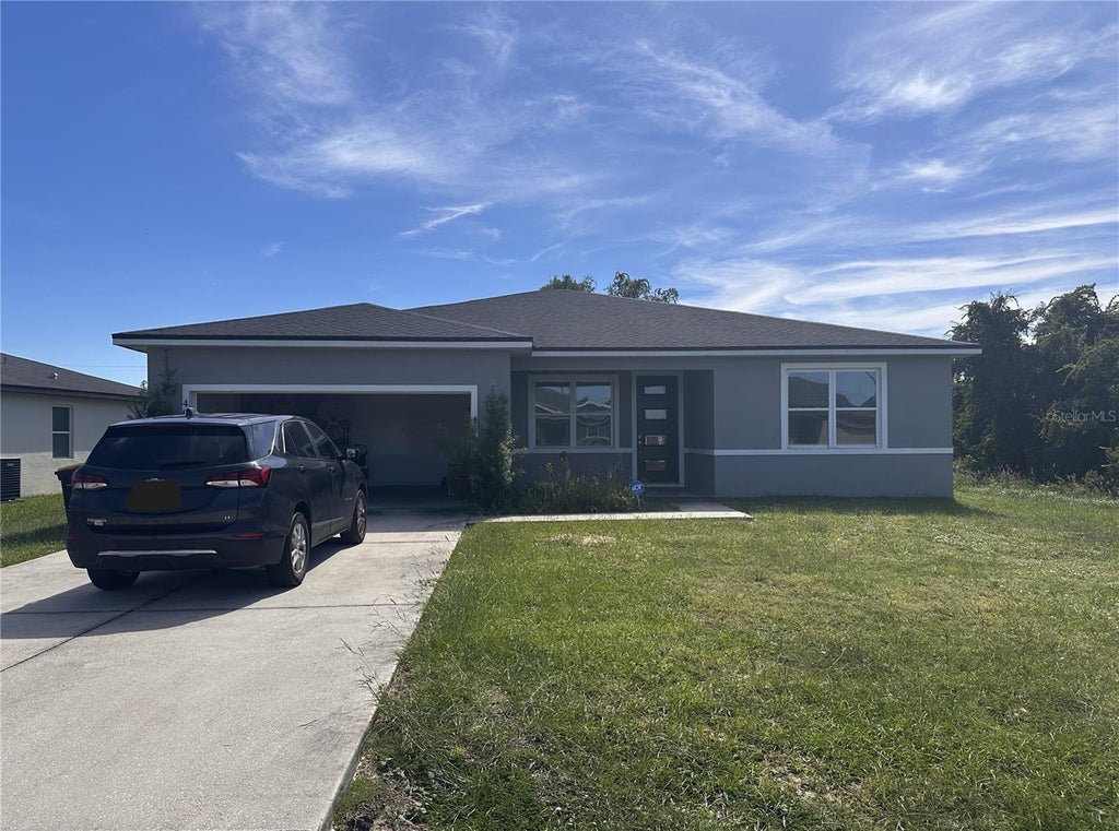 Photo of 40 Orchid Lane, Poinciana, FL 34759 (MLS # A4708117)