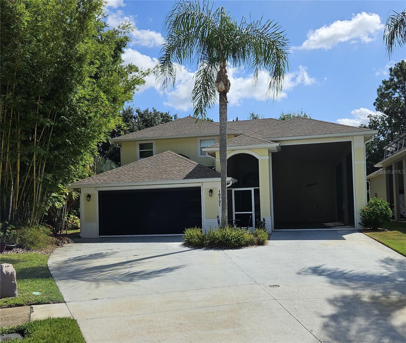 This is the RV Home of your dreams, in a great community! Close to Disney and area attractions, near shopping, dining and major highways. This very open, contemporary floor plan is unlike any you will see in other RV compatible communities! This Contemporary Home sits on an Environmental lot which means there is a back yard, with screened in patio & porch, with lake views! It has a very Open floor plan, with high ceilings, and plenty of windows that let in the light. The Master bedroom on the first floor, and has french doors leading out to the covered screened patio. The additional bedrooms upstairs. There is also a half bath downstairs for your guests. You will find Plenty of storage in the home. Park your RV in the Fully Screened 40' RV port which includes 50 amp electric and water & sewer hook ups. This home sits at the back of the cul de sac, and is a friendly Golf Cart community. Don't miss this custom home, situated on the private lot with great outdoor living space. There is an updated, Open kitchen, dining and great room. Awesome windows let in light, and large Lanai allows for casual entertaining outside. This home is at the back of the community, so not a lot of through traffic, and you have a back yard with an environmental and pond view, and pavers around the back and side yard. New Roof, gutters and gutter guards were installed in 2023. Water Softner was put in 2020, new hybrid water heater in 2020, new dishwasher in 2025. The AC was installed in 2016. The garage also has screens for ventilation for your projects. This home comes complete with a top of the line, HotSprings Hot Tub, and gas grill. Was recently painted inside, and new blinds put in 2024. The Washer and Dryer also convey. Come check this one out, you won't be sorry!