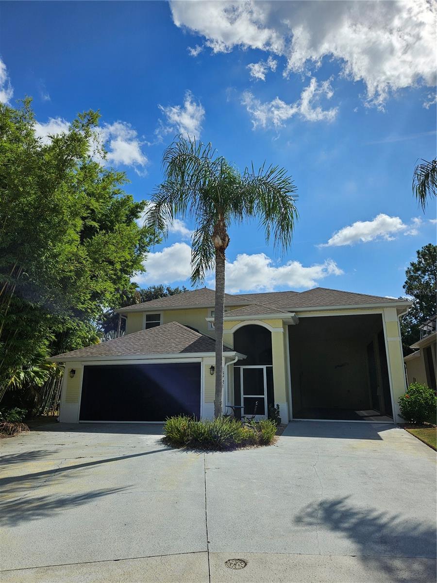 This is the RV Home of your dreams, in a great community! Close to Disney and area attractions, near shopping, dining and major highways. This very open, contemporary floor plan is unlike any you will see in other RV compatible communities! This Contemporary Home sits on an Environmental lot which means there is a back yard, with screened in patio & porch, with lake views! It has a very Open floor plan, with high ceilings, and plenty of windows that let in the light. The Master bedroom on the first floor, and has sliding glass doors leading out to the covered screened patio. The additional bedrooms upstairs. There is also a half bath downstairs for your guests. You will find Plenty of storage in the home. Park your RV in the Fully Screened 40' RV port which includes 50 amp electric and water & sewer hook ups. This home sits at the back of the cul de sac, and is a friendly Golf Cart community. Don't miss this custom home, situated on the private lot with great outdoor living space. There is an updated, Open kitchen, dining and great room. Awesome windows let in light, and large Lanai allows for casual entertaining outside. This home is at the back of the community, so not a lot of through traffic, and you have a back yard with an environmental and pond view, and pavers around the back and side yard. New Roof, gutters and gutter guards were installed in 2023. Water Softner was put in 2020, new hybrid water heater in 2020, new dishwasher in 2025. The AC was installed in 2016. The garage also has screens for ventilation for your projects. This home comes complete with a Hot Tub, and gas grill. Was recently painted inside, and new blinds put in 2024. The Washer and Dryer also convey. Come check this one out, you won't be sorry!