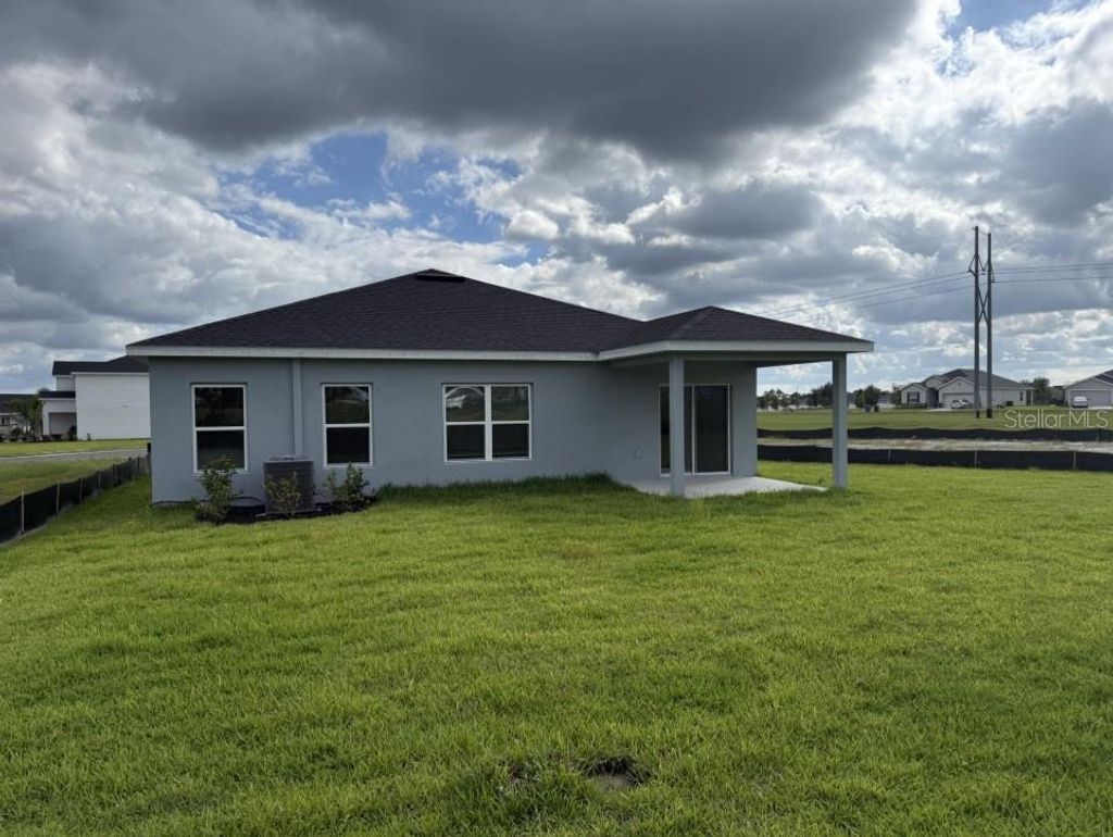 Photo of 1609 Starling Song Lane, Lakeland, FL 33811 (MLS # W7879434)