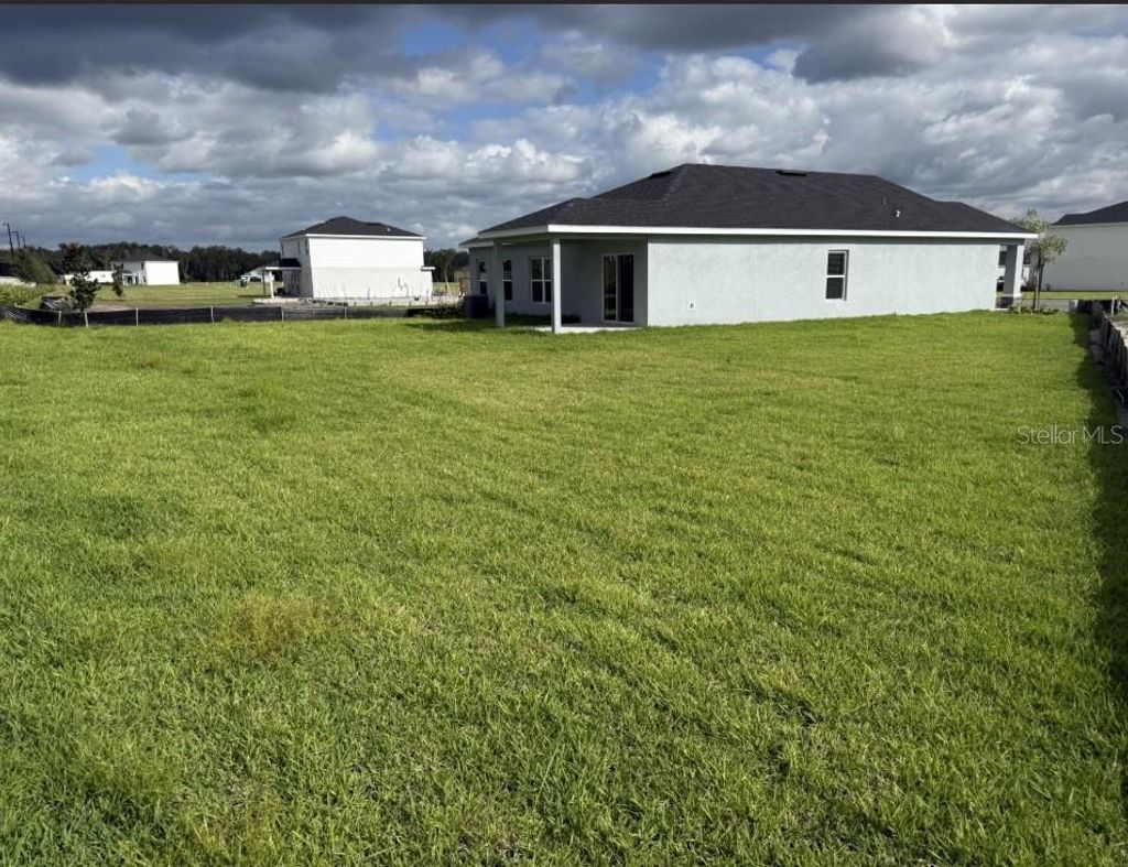 Photo of 1609 Starling Song Lane, Lakeland, FL 33811 (MLS # W7879434)