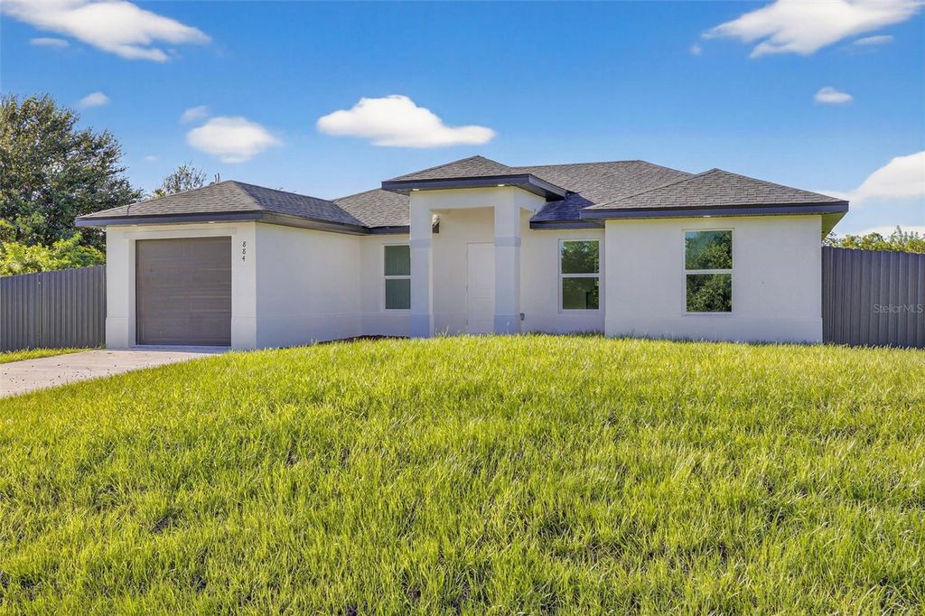 Photo of 884 Chemstrand Street E, Lehigh Acres, FL 33974 (MLS # O6350788)