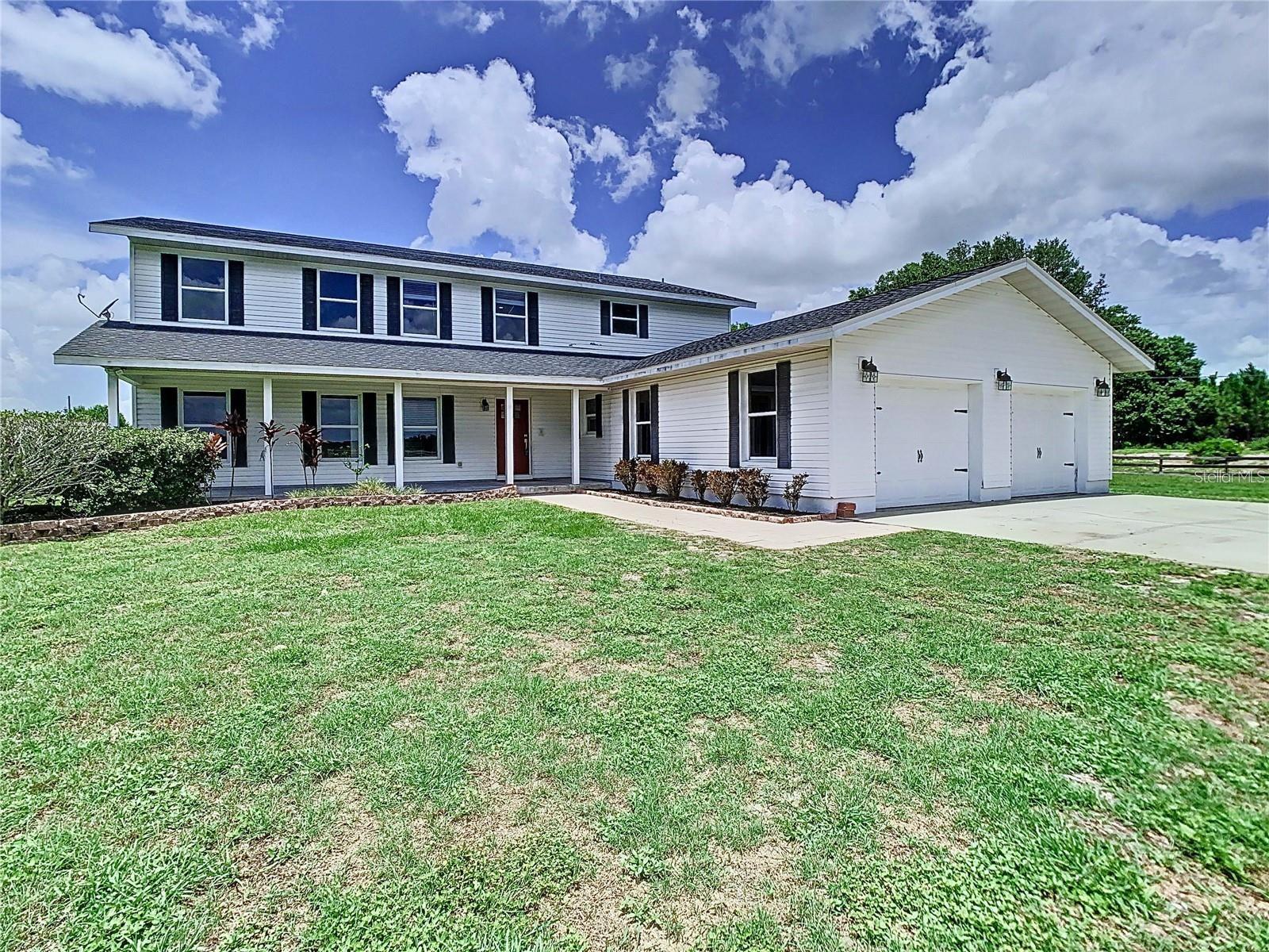 Your Private Florida Oasis Awaits! Indulge in the true Florida lifestyle with this exquisitely renovated 4-bedroom, 3-bath, 2-car garage home. Nestled on an expansive, fully fenced acreage lot in a desirable rural setting, this property promises privacy and tranquility.
Inside, you'll be greeted by gorgeous real wood floors, an updated kitchen designed for the home chef featuring stainless steel appliances and gleaming granite countertops, and abundant storage. High ceilings create an airy atmosphere, complementing the spacious great room with its convenient eat-in kitchen area. This home offers remarkable flexibility with an owner's suite on the first floor and a primary suite upstairs, each boasting its own private ensuite. French doors beckon you to the incredible screened-in pool area (being resurfaced for you!) and expansive outdoor living space – perfect for year-round enjoyment. Live your piece of paradise! Book your showing today