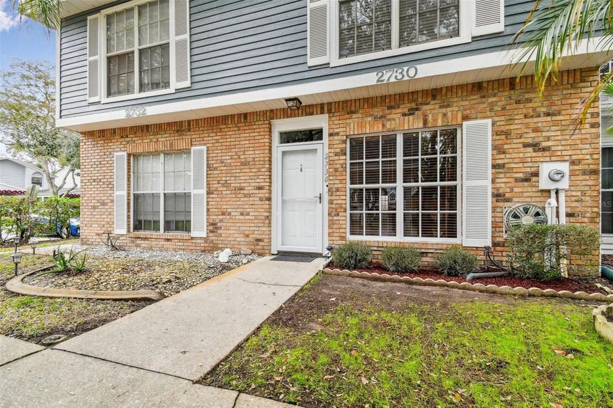 See this stunning townhome with three bedrooms and 2.5 baths in the highly desirable Village of Somerset Woods in Palm Harbor. In the heart of it all, this townhome has so much to offer. On the first floor, you'll find a spacious living room with a wood-burning fireplace, a formal dining room, a convenient half-bath, an eat-in kitchen and breakfast bar. The kitchen overlooks the screened patio, which includes a laundry closet for your washer and dryer. The backyard boasts a small garden and a private fence. Upstairs, all bedrooms are located, including a large primary bedroom with its own en-suite bath. The exterior features a carport with additional storage space in the attic. Notable updates include a new sewer line and pump in March 2020, as well as a new roof in February 2022. The HOA covers trash removal, lawn care, tree trimming, streetlights, and access to the community pool. Don't miss out on this fabulous townhome.