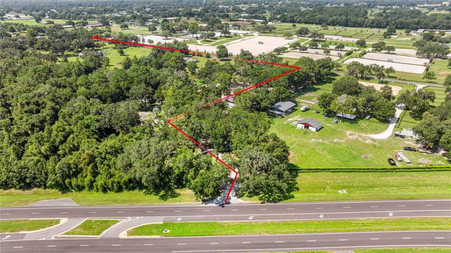 ***FULLY RENTED FOR SEASON!!!***Turnkey Equestrian Compound Directly Across from HITS Post Time Farm! AND ONLY 12 MILES TO THE WORLD EQUESTRIAN CENTER OCALA FL. An exceptional opportunity to own a fully operational, income-producing equestrian facility on over 7.5+ acres in one of the most coveted locations in Ocala — directly across from the world-renowned HITS Post Time Farm. This meticulously maintained property includes 5 updated residential cottages and top-tier equine amenities, making it ideal for investors, trainers, or equestrian professionals. Residential Cottages • Cottage 1: Fresh paint, new appliances, walk-in tiled shower, new toilet, ceiling fans • Cottage 2: New paint, new ceiling fans, new toilet & vanity • Cottage 3: Fireplace, new flooring, fresh paint, new vanity, fenced backyard • Cottage 4: Brand new deck, fresh paint • Cottage 5 (currently being finished): New kitchen, flooring, fans, toilet, vanity, and windows Equestrian Facilities • 3 barns with 23 stalls (12x12) — most with fans and automatic waterers • Liquid rubber flooring in stalls, epoxy-coated wash bays, updated electrical, washer/dryer hookups • 9 turnout paddocks with fencing • 60,000 sq ft professional riding arena with sprinkler system and observation deck • 3 covered wash stalls, 2 tack rooms, dog runs, and 2 gated entrances • 10 RV hookups (50 Amp) with water and sewer clean-outs. Property Enhancements • Freshly painted fencing with many new boards • Extensive dead tree removal for a clean and safe environment Income Potential • Current achievable revenue: ~$25,000+/month off-season | ~$40,000+/month in season • Achievable cap rate: 11-13% through stall rentals, Airbnb stays, event hosting, parking, and referrals • In-season dry stall rentals: $500+/week (includes turnout & arena use) This versatile and high-yield property is truly turnkey — ideal for seasonal business or full-time operation. With its proximity to major events and showgrounds, the demand is built-in. Don’t miss this rare opportunity. Whether you’re an equine investor, trainer, or entrepreneur, this property is ready to deliver value from day one. Learn more about HITS at hitsshows dot c o m