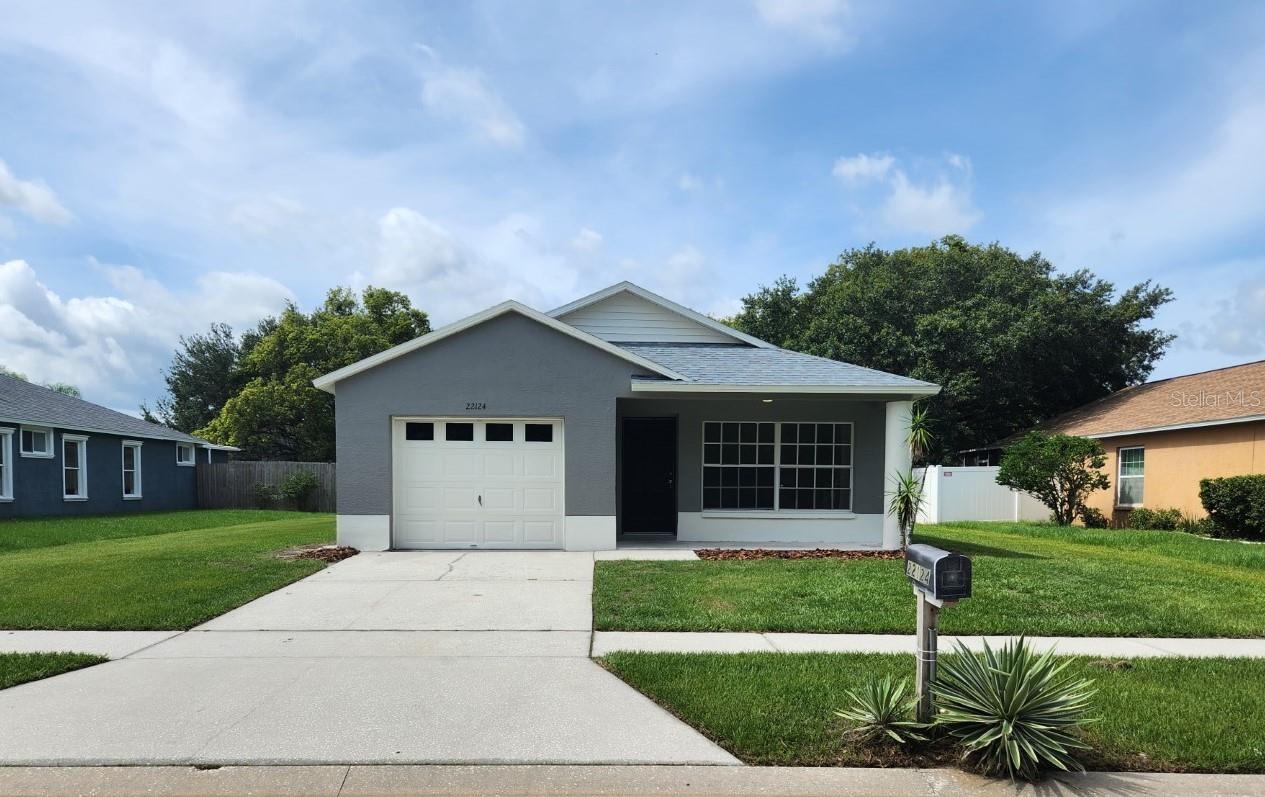 Under contract-accepting backup offers. Beautifully updated and upgraded 4 bedroom, 2 bath, 1 car garage home centrally located in Land O Lakes with no HOA fees. Brand new roof 2023. New paint inside and out. All new tile flooring. Completely new kitchen. Enter to a formal living room and continue on to the large living room and kitchen. The kitchen includes all new cabinetry, new granite counter tops and brand new Stainless Steel appliances. Large master suite has sliding glass door to the exterior and bathroom with a brand new vanity with granite top and shower/tub combo. Split floor plan offers 3 additional bedrooms and a 2nd bath with brand new vanity with granite top and shower/tub combo. Large backyard area with a patio slab. Don't miss out!