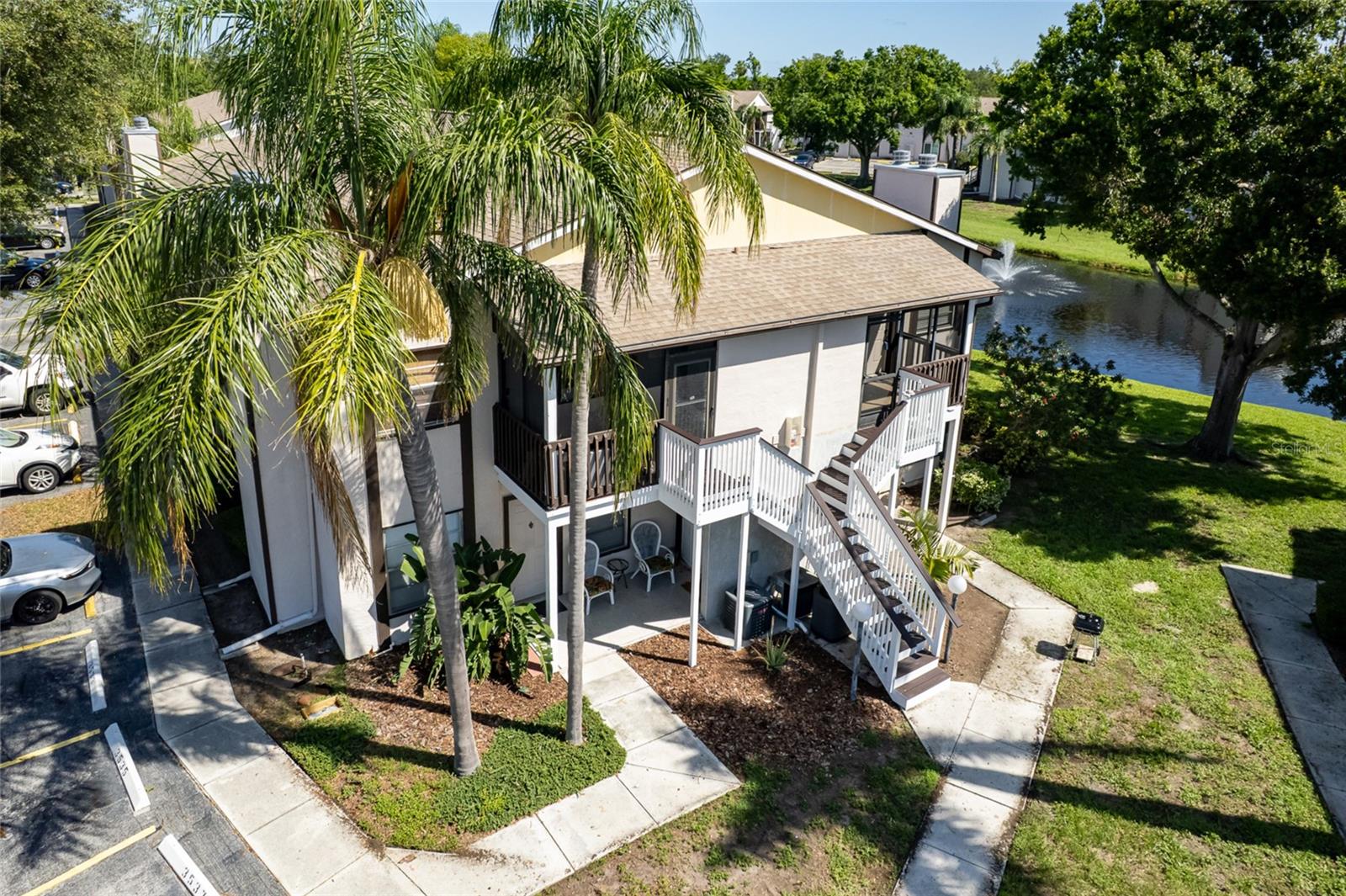 Discover your perfect retreat in this beautifully appointed second-floor condominium featuring lake views, vaulted ceilings and thoughtful upgrades throughout. The welcoming living room,seamlessly flows into the dining area and kitchen. The master bedroom boasts a generous walk-in closet with ample storage and private en-suite bathroom. Additional conveniences are a second full bathroom with linen/storage closet, private in-unit washer and dryer in dedicated utility closet, and an expansive screened front lanai with room for seating and additional storage. Located in the sought-after Mirror Lake community, you'll enjoy the ideal balance of tranquil living and convenient access to everything Southwest Florida has to offer. Minutes from IMG Academy, a short drive to pristine Anna Maria Island beaches and surrounded by premium shopping, dining, and entertainment. The Mirror Lake community is completing a comprehensive exterior renovation featuring fresh paint, updated stairs, and enhanced screened lanais - adding both beauty and value to your investment. The HOA fee covers, Community recreation and maintenance, cable TV, sewer, and trash collection - simplifying your monthly expenses and maximizing your value. A sparkling community pool, fully equipped fitness center, professional tennis courts and children's playground all await you at this pet friendly community.
