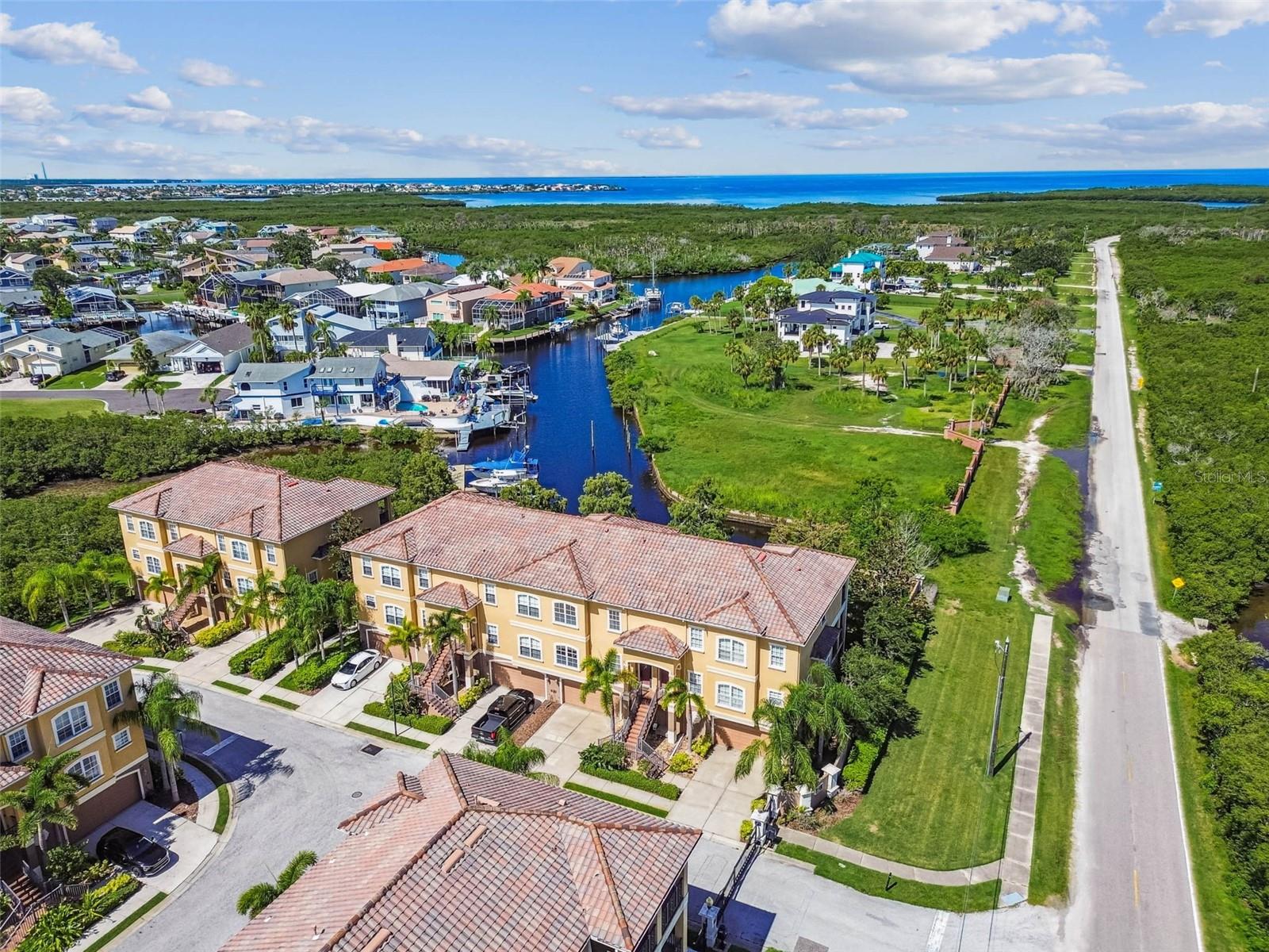 Waterfront Luxury... ELEVATOR! Private 40 ft Boat DOCK and 20,000 lb Boat LIFT includes electric and water right out your back door...Access to Community Boat Ramp...Private Beach! Stunning views! A must to see! Elevator access from garage to all floors. Gourmet kitchen features beautiful wood cabinets, granite countertops, farmhouse sink, slide out drawers and shelving. Newer stainless steel appliances, built in oven, gas cooktop, microwave, overlooking great room to screened balcony to enjoy the breathtaking views & sunsets. Lots of natural lighting, bamboo flooring and a gas fireplace in great room. All areas have crown molding. Bamboo wood floor stairway, LR, DR. Master bedroom suite - Private screened balcony, crown molding, gas fireplace, large walk in closet. Remodeled Master bath - jetted tub, double sinks, walk in shower in master bathroom. Guest bedroom with en-suite bath. Screened first floor screened porch entertaining area; overlooks water, perfect for entertaining. Oversized garage can accommodate up to 3 cars, tiled floor & extra space for storage. Both A/C units replaced 2023, water heater replaced 2022 and boat dock updated with 20,000 lb. lift. Resort style living, you will not want to leave home. Maintenance free living includes common areas, exterior, roof, flood insurance, ground maintenance, irrigation, security gated. Private beach membership, Gulf Landings Association boat ramp, clubhouse, pool, hot tub, tennis courts. Convenient to everywhere! Walk to Green Key Beach. Let's make this your new water front home.
--