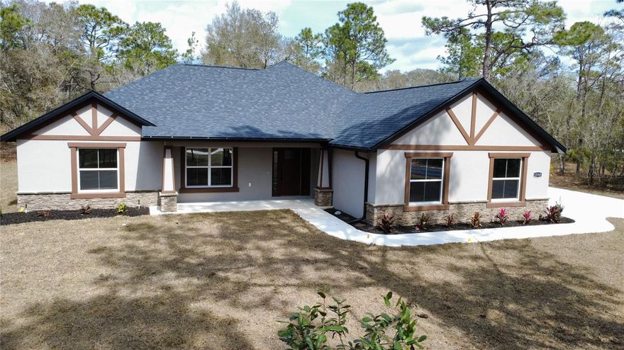 Under Construction. Modern Elegance on 1.10 Acres in Rolling Hills

Experience the perfect blend of privacy and  design in this brand-new construction home, available mid-Feb. Situated on a sprawling 1.10-acre lot, this home offers the rare luxury of space without sacrificing modern convenience.

The heart of the home features an expansive open floor plan anchored by soaring cathedral ceilings and durable, high-end LVP flooring. The chef-inspired kitchen boasts custom wood cabinetry and sleek quartz countertops, flowing seamlessly into the living area—ideal for hosting. Retreat to the private Master Suite, a true sanctuary featuring "his and her" closets and a spa-like bath with a deep soaking tub and a custom walk-in shower.

Enjoy Florida evenings on your spacious covered lanai or the charming front porch. With a side-entry garage and a versatile den perfect for a home office, every detail has been meticulously crafted for the modern homeowner. Peace of mind comes standard with a full One-Year Builder Warranty.

NEW CONSTRUCTION | Completion Mid-Feb
Space: 2,249 Sq Ft Living | 3,203 Sq Ft Total Under Roof
Land: 1.10-Acre Sprawling Lot in Rolling Hills
Design: 3 Bed + Den / 2 Bath / Side-Entry 2-Car Garage
Finishes: Quartz countertops, wood cabinets, and LVP flooring throughout (tile in baths).

**Seller is a licensed Real Estate Agent.**