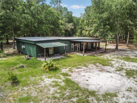 Photo of 3749 SW 22nd Place, Bell, FL 32619 (MLS # GC533882) Photo of 3749 SW 22nd Place, Bell, FL 32619 (MLS # GC533882)