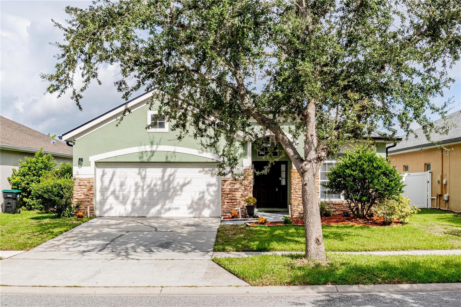Welcome home to this beautiful, move-in ready 4-bedroom, 2-bathroom home located in the Falcon Trace community with a gorgeous water view! The kitchen is a show stopper with brand new cabinets, stainless steel appliances, and beautiful waterfall quartz countertops. At the front of the home, you’ll find the 4th bedroom which could be used as an office or den, and a hallway with 2 guest bedrooms and a bathroom in the middle. Make your way to the heart of the home where vaulted ceilings elevate the room creating an open and airy space. The primary bedroom is tucked up at the back of the home with a beautiful ensuite and walk-in closet. Step out back to your porch overlooking the luscious green space out back. Falcon Trace Community offers waterfront amenities including a huge pool with waterslide, tennis and basketball courts, playground and lake viewing deck. Prime location to 417, Turnpike, Osceola and John Young Parkways that all provide quick access to Theme Parks, Orlando International Airport and Lake Nona Medical City. The community has Endeavor Elementary School right across the street and shopping nearby at Hunters Creek Publix, Super Target, CVS, The Loop and many restaurants all within minutes from you! Hurry this will not last!