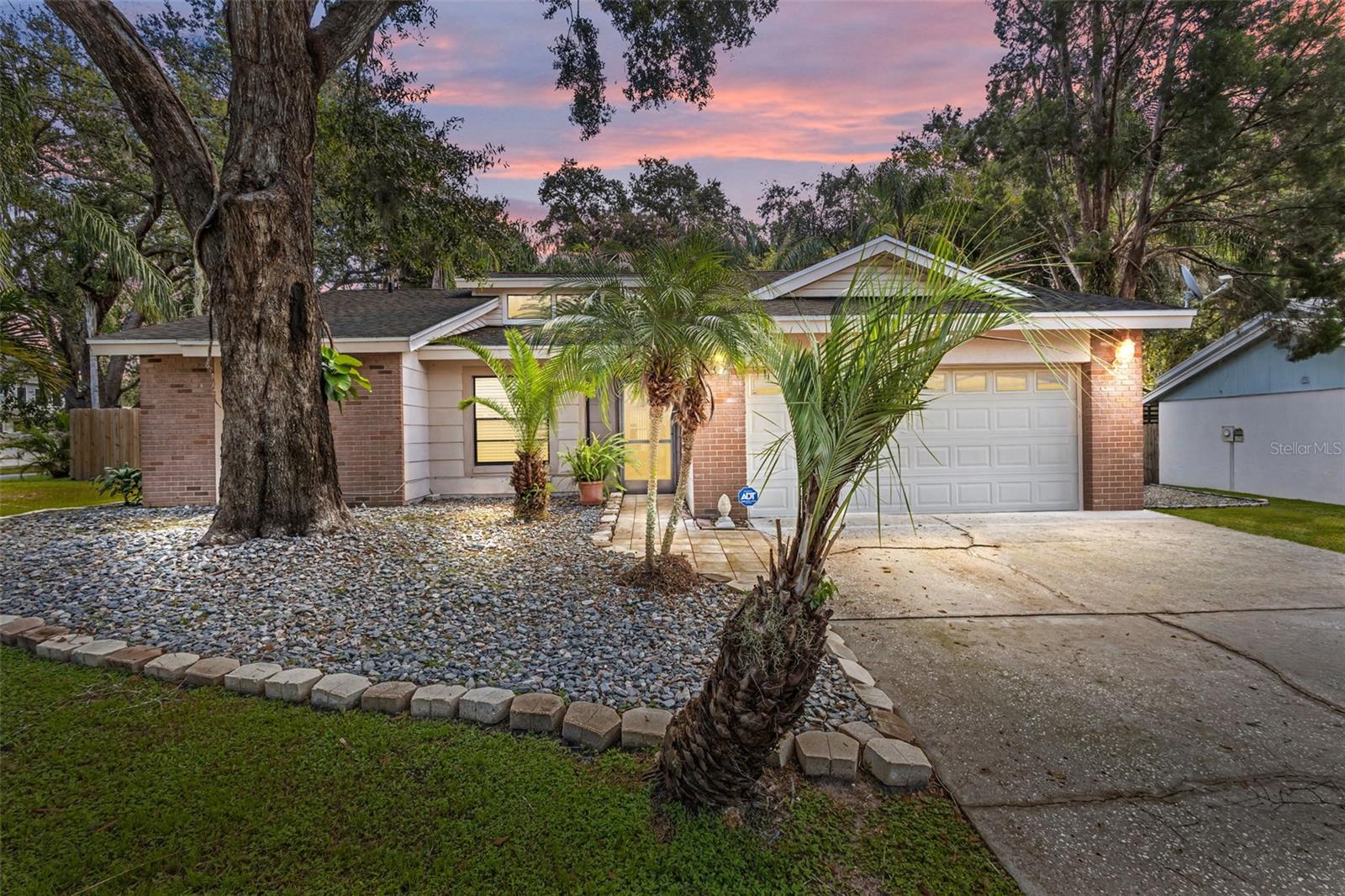 One or more photo(s) has been virtually staged. Well-Maintained, Loved Home on a Corner Lot with No HOA!
Welcome to this beautifully cared-for home, ideally situated on a spacious corner lot at the end of a quiet road in Valrico. This inviting property combines style, comfort, and modern convenience—without the restrictions of an HOA.
Recent updates provide peace of mind, including a brand-new 2024 roof, new plumbing, new hot water heater, upgraded kitchen cabinets, new exterior fencing and fresh interior paint throughout. The home also features new luxury vinyl plank flooring, modern window treatments, and two bathrooms with updated vanities, and stylish finishes.
Inside, the bright open layout flows effortlessly from room to room, perfect for both everyday living and entertaining. The spacious living and dining areas offer plenty of room for family gatherings, while the enclosed bonus room is ideal as a home office, playroom, gym, or hobby space. Added conveniences include an indoor laundry room and a fully equipped ADT security system with cameras.
Your private retreat awaits in the large master suite, complete with vaulted ceilings, abundant natural light, a generous walk-in closet, and a spa-inspired bathroom featuring double vanities, and walk-in shower.
Step outside to your own backyard oasis! Relax year-round on the oversized lanai overlooking the screen-enclosed pool—perfect for entertaining, enjoying a quiet cup of coffee, or soaking up the Florida sunshine. The low-maintenance landscaping adds beauty and ease of care.
Located in a prime Valrico neighborhood, this home offers both privacy and convenience. You’ll enjoy quick access to shopping, dining, and entertainment, along with an easy 20-minute drive to downtown Tampa and just a short trip to the Gulf beaches. All will love the proximity to local schools, parks, recreation, restaurants and shopping.
This move-in-ready property has it all—a spacious master retreat, luxury updates, private pool, and no HOA. Don’t miss the chance to make this beautifully maintained Valrico home your own!
