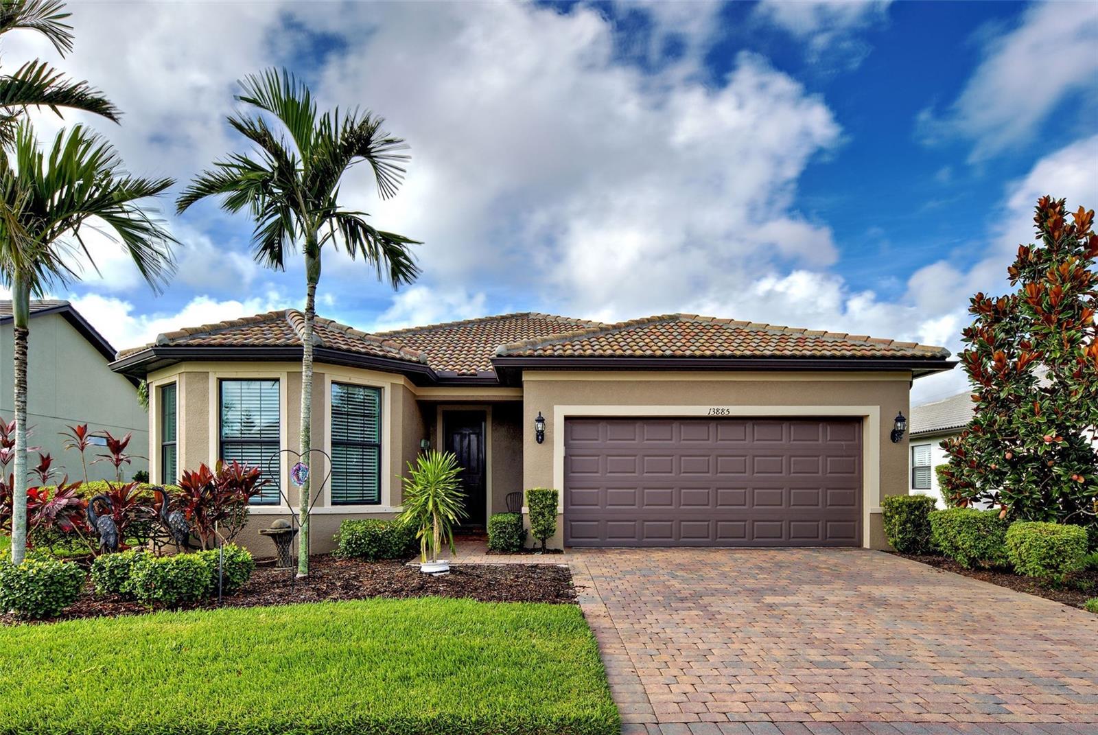 Stunning PARTIALLY FURNISHED Abbeyville POOL home in IslandWalk, boasting 1,800 sq ft, featuring a spacious open floor plan, abundant natural light, and a PREMIUM OVERSIZED LOT, with lovely WATER VIEW! The highlight of this property is the EXTENSIVE LANAI, offering OVER 1000 Sq Ft of OPEN AREA and 120 sq ft of COVERED AREA, ideal for al fresco dining! With a large (14x30 feet) HEATED AQUATECH POOL, a spacious SPA (8.4 X 8.4) and decorative STONE flooring, you will be able to relax and entertain all year round. The kitchen offers a LARGE ISLAND, ideal for cooking and casual dining, ample cabinetry, a built-in pantry, and is perfectly positioned adjacent to the dining room and the additional SUNROOM, that creates a flexible space for dining, reading, a playroom, or simply unwinding. The primary suite showcases a TRAY CEILING, a ceiling fan, a generous walk-in closet, and a beautiful en-suite bath with glass-enclosed walk-in shower. The guest bedroom features charming turret windows, bringing plenty of natural light in, a generous built-in closet, a ceiling fan, and it is paired with a full guest bath, including a bathtub with glass doors and a linen closet, providing additional storage. You'll love the spacious laundry room equipped with white cabinetry, tile flooring and ADDITIONAL STORAGE CLOSET. The versatile flex room offers ideal functionality as a home office, den, or potential third bedroom. The garage features plenty of OVERHEAD RACKS FOR STORAGE and EPOXY FLOORING. The exterior of this home was freshly painted in 2024 and it is situated on a lot which is bigger than the usual size for this floor plan. For peace of mind, a 1 YEAR AHS HOME WARRANTY is offered to the new homeowners. All homes on Sayda Street were built on lots originally designated for estate homes, resulting in each home site being much larger. It’s conveniently located on a tranquil street, just two blocks away from the main resort center. Future connectivity to Manasota Beach Road (projected to be done by August 2026) will enhance this home’s already excellent accessibility. Residing in Islandwalk will give you a sense of resort-style living all year around since it is a very active community with rich amenities including geothermal pools, Har-Tru tennis, pickleball and bocce ball, lap pools, spas, playground, basketball court, a dog park, two State-of-the-Art Fitness Centers, a 24 hr staffed front gate, on site 7 day/week HOA staff, outdoor pavillions with BBQ grill, a library and much more that will keep you and your guests active and engaged. Golf carts are permitted throughout the community and can be taken out of the community if registered. Enjoy exclusive access through a resident-only back gate to the exciting Downtown Wellen Park, featuring a Marketplace anchored by Publix, Atlanta Braves ballpark, restaurants. Conveniently located just 4 miles from I-75, it offers easy access to multiple pristine Gulf beaches and airports. Historic Venice Island, and cultural events are just a short drive away.