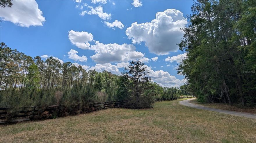 Looking for that perfect NW Gainesville location for your new home site? This lovely, 5.74-acre parcel near Turkey Creek Preserve is just beckoning for the realization of your dreams. Currently planted with immature pines, this property also includes a pole barn and tack room. Tucked away from it all but close to everything accessible by US-441 N and NW 43rd St., nearby conveniences including shopping, restaurants, farmers' market, and entertainment venues. Whether you work and play in Gainesville or Alachua, you'll look forward to coming home each evening to this naturally serene setting.