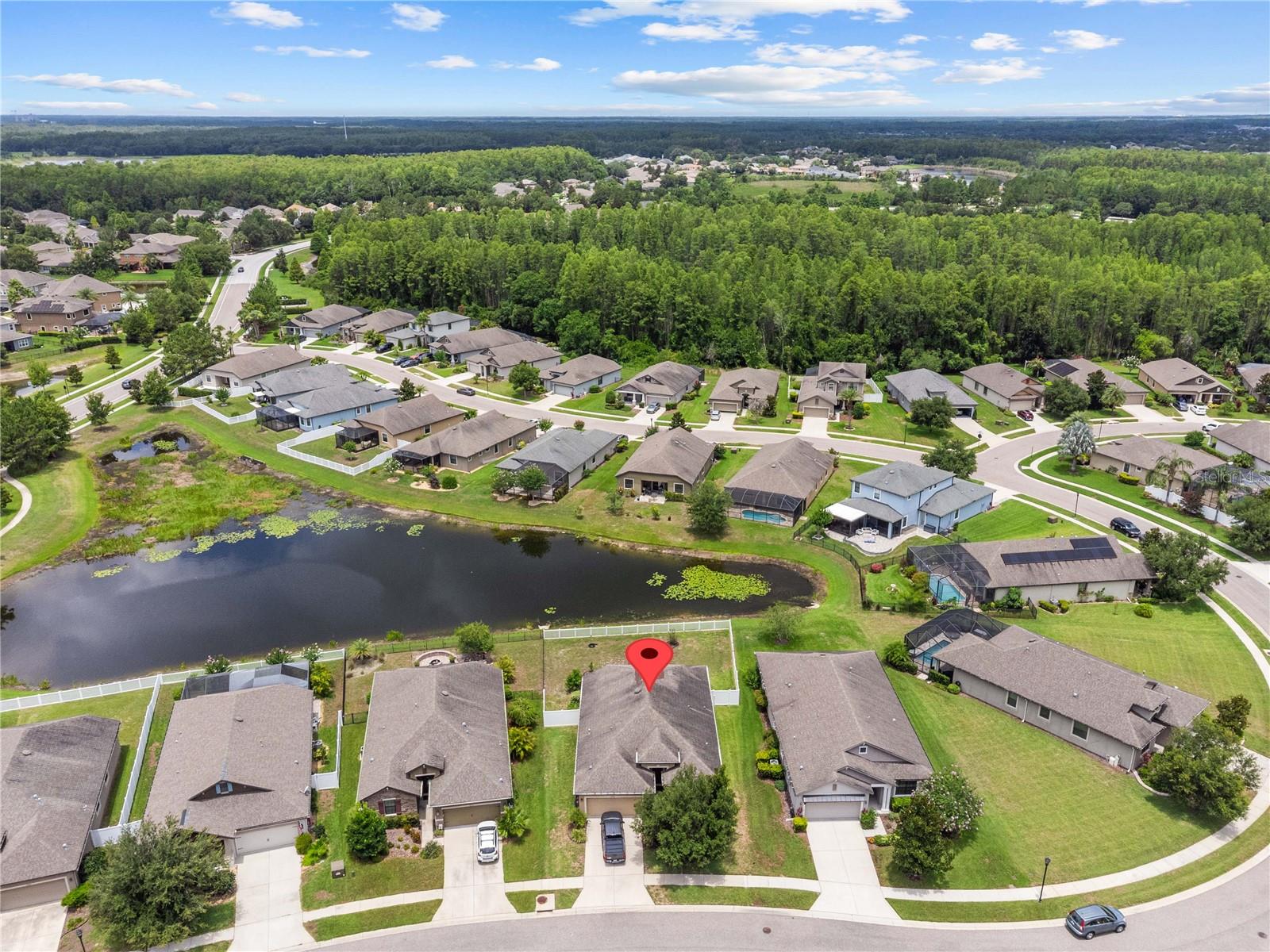Located on a unique pie-shaped oversized lot with tranquil pond views, this beautifully maintained 3-bedroom, 2-bathroom home built by William Ryan Homes offers comfortable one-story living in one of Land O’ Lakes’ most sought-after gated communities.
The home features a well-designed split-bedroom floor plan that ensures both privacy and functionality. At the center of the home is an eat-in kitchen equipped with stainless steel appliances, a gas stove, granite countertops, and stylish pendant lighting—perfect for everyday living or entertaining. A formal dining room offers an elegant space for hosting gatherings.
The spacious primary suite includes a walk-in closet and an en suite bathroom with double sinks, a soaking tub, and a separate shower, providing a peaceful retreat. Two additional bedrooms are generously sized and ideal for family, guests, or a home office.
Step outside to enjoy the Florida lifestyle with a covered back porch that opens to a large, fully fenced backyard. The paver patio and built-in fire pit create an inviting outdoor space perfect for relaxing or entertaining year-round.
Additional features include a two-car garage and the added benefit of no flood insurance required.
Lakeshore Ranch is a vibrant, gated community known for its resort-style amenities and 24-hour manned guard gate. Residents enjoy access to a luxurious clubhouse, fitness center, massage room, amphitheater, fishing pier, three community pools including a heated lap pool, tennis and pickleball courts, basketball courts, dog park, and covered playground. The community is golf cart friendly and offers a truly active and connected lifestyle.
Conveniently located near shopping, dining, golf, and top-rated schools, with quick access to major highways, downtown Tampa, and Gulf Coast beaches, this home combines luxury, functionality, and a prime location. Don’t miss your chance to own this exceptional property in the heart of Land O’ Lakes. Schedule your private showing today.