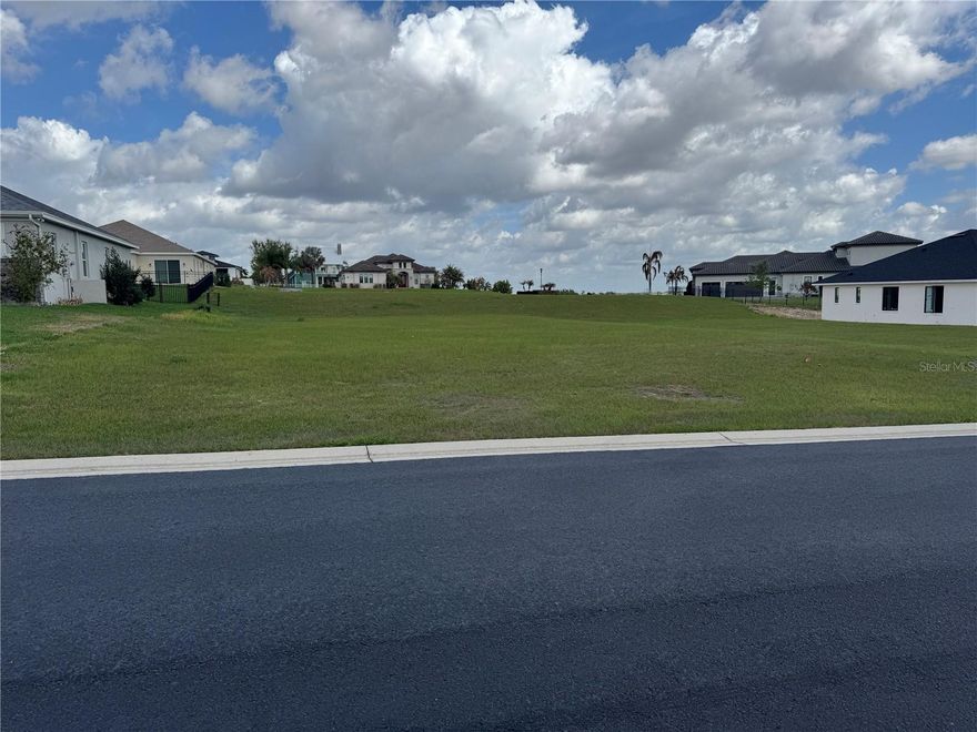 Build your dream home in the highly sought-after Water Ridge community in Lake Alfred! This prime .28-acre homesite is fully ready to build, offering an ideal layout with approximately 76 feet of frontage and dimensions of 76’ x 163’, providing ample space for a thoughtfully designed custom residence. Nestled within a beautifully maintained, gated community, this lot offers not only privacy and security but also access to an impressive array of resort-style amenities. Residents enjoy a stunning clubhouse, state-of-the-art fitness center, onsite HOA management, men’s and women’s saunas, and multiple sports courts featuring basketball, tennis, and pickleball across both Lake Alfred and Auburndale sections. Relax and unwind with access to two leisure pools and a dedicated lap pool, or take advantage of the three private boat docks for easy lake access. A boat trailer storage facility and five gated entries add to the convenience and exclusivity of this exceptional neighborhood. Whether you're building your forever home or a seasonal retreat, this is a rare opportunity to secure a premium homesite in one of Central Florida’s most desirable waterfront communities.