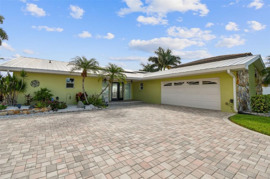 Discover the epitome of Intracoastal living - Introducing 850 Capri Blvd. Located on the point of beautiful Isle of Capri, you will be captivated by the tranquility as soon as you pull into the driveway. Step through the door and be welcomed by the amazing water-view. Drop your keys on the coffee table and head out to your personal oasis complete with sparkling blue pool with heated spill-over spa, spacious covered patio with outdoor shade blinds, beautiful greenspace (there's even room for a garden), outdoor shower, huge storage shed, newer seawall (approximately 11 years old) and a dock. Oh yes, the dock - your brand-new dock - with boat lift and power & water.  Enjoy morning coffee on the dock and take in a gorgeous sunrise. Or spend the evening with a refreshing beverage and be entertained by watching the marinelife.  

The interior of this 3-bedroom 2-bath home is just as special!  Immaculately maintained and thoughtful updates and upgrades have been made. This home has hurricane rated windows and sliders.  The kitchen is a dream with soft-close solid wood cabinetry, stone counter-tops, stainless-steel appliances and a gas cooktop.  The built in ice maker and water filtration system are a luxurious touch.  Off the kitchen, the dining area includes an extension of the beautiful wood cabinetry from the kitchen creating built-ins that are as functional as they are beautiful. The open floor plan allows you to enjoy that beautiful view from almost anywhere in the home.  Reclaimed wood beams add an elegant touch to the vaulted ceilings in the living and dining areas. Featuring a split bedroom plan and updated bathrooms, there is nothing left for you to do but move in.

The list of improvements is impressive and includes Generac 22kw, whole house generator with Generator Transfer Switch Surge Protector installed (2021), new dock (2021), AC/Heat pump replaced in 2018, bathroom remodels (2018 - guest bath, 2021 - main bath), new refrigerator in 2021,updated propane tanks in 2021 to now include (2) 120 gallon tanks, new solar panels installed in 2018 help save on electric costs and are paid in full, and so much more!  Honestly, there is no way to tell you everything about this amazing property - you must experience it!  Come experience 850 Capri Blvd. and turn YOUR DREAMS of waterfront living into YOUR REALITY!  
All information is believed to be accurate but is not guaranteed. Buyers and agents should verify all facts and information pertinent to their purchase decision.