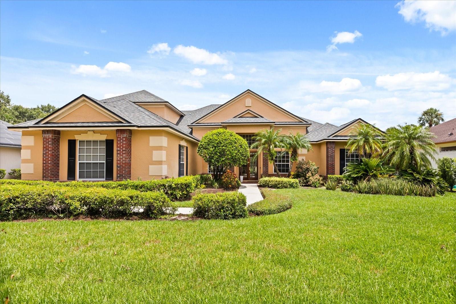 Welcome to luxury living in the gated community of the Reserve at Tuscawilla! This elegant 4-bedroom, 4-bathroom estate features a dedicated home office, spacious bonus room, and a 3-car garage nestled on a generous .34 acre lot. Soaring 12–14' coffered ceilings enhance the open and airy feel throughout. The open-concept kitchen is the heart of the home, featuring a large center island, perfect for entertaining and casual dining. The kitchen flows seamlessly into the spacious family room, which boasts a cozy fireplace and a clear view of the posh covered patio and heated screen pool. Enjoy the outdoors year-round with a spacious pool deck overlooking tranquil conservation and a serene pond—perfect for relaxing or entertaining in your private backyard oasis. The luxurious primary suite is a true retreat, boasting two walk-in closets, soaring tray ceilings with crown molding, and a spa-like bathroom complete with a jetted Jacuzzi tub, walk-in shower, linen closet, and a private toilet room. Bedroom 2 includes a walk-in closet and an ensuite bathroom with a Jack and Jill door—perfect for added privacy. Bedrooms 3 and 4 also feature walk-in closets, offering generous storage and comfort for family or guests. The second-floor bonus room with a full bathroom offers versatile space perfect for a media room, play area, or whatever suits your lifestyle. Zoned for top-rated Seminole County schools, this home is ideally located just minutes from the 417, offering easy access to Downtown Orlando, UCF, and both Orlando and Sanford airports. Conveniently close to major shopping, hospitals, dining and highways. Don't miss this rare opportunity to own a home in that combines luxury, comfort, and nature’s beauty all in one. Schedule to preview this spectacular home today!