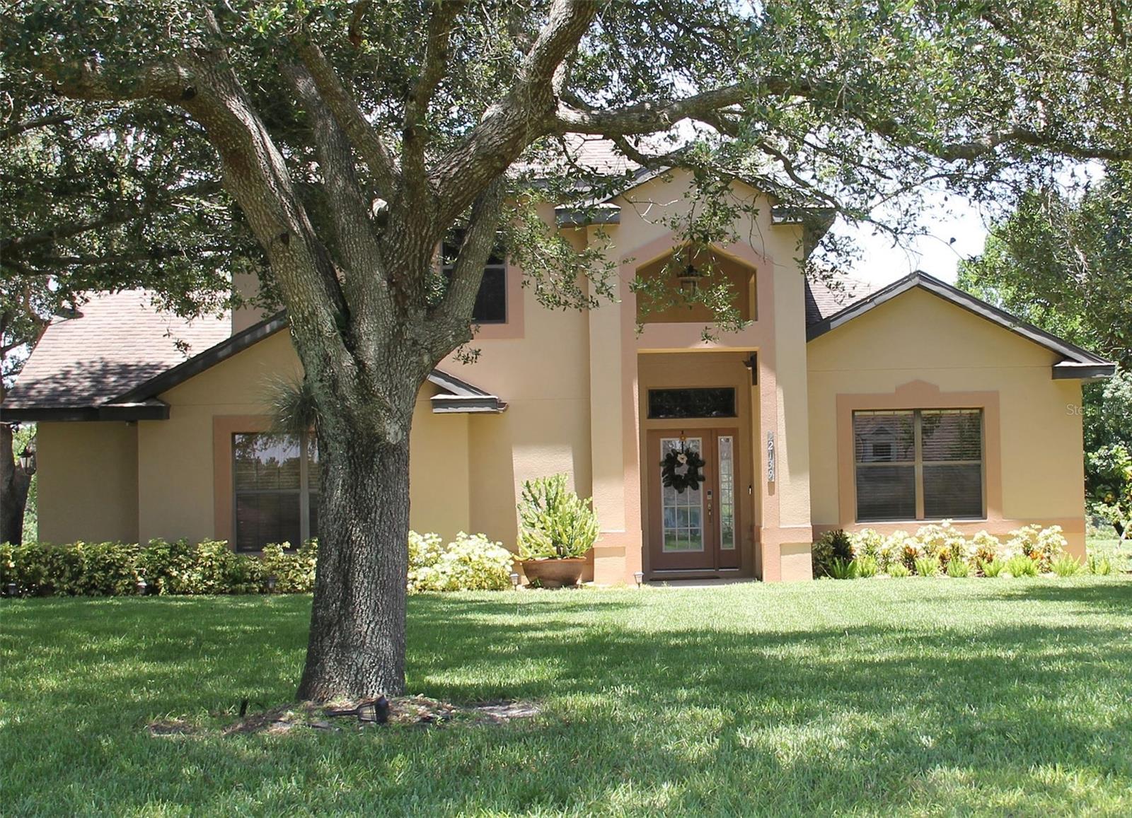 Don't miss this incredible opportunity to own a one-of-a-kind home tucked away in the upscale and highly sought after community of The Hills of Mount Dora! Nestled on a stunning 1.4-acre lot, this beautifully maintained 3 bedroom 2 bath custom built home with spacious bonus room blends modern conveniences with exceptional outdoor living. The home is framed by lovely mature landscaping with the perfect majestic oak as the crowning glory of the front yard. The Exterior was recently painted and the interior just freshened up prior to listing. A brand-new roof (2025), New AC (2022), plus Alarm System ensuring security with Ring doorbell for peace of mind, This home is truly move-in ready! Inside, vaulted ceilings and an open-concept living space creates an inviting atmosphere with the kitchen as the center of the home makes this home perfect for entertaining friends or favorite family gatherings! Beautiful dramatic black Quartz countertops, numerous wood cabinets, spacious pantry closet with huge bar the length of the entire kitchen makes this your dream kitchen! French doors lead to a generous size screened back patio overlooking the spacious rolling rear of the property—a perfect place to relax. The spacious master suite includes a walk-in closet, and a spacious ensuite bath with double vanity, granite countertops, and a tiled glass walk-in shower. Two additional bedrooms with a very generous 2nd floor bonus room with closet allows for many possibilities from a 4th bedroom to a home office or perfect game room. Large Covered front porch ready for your rocking chairs Located just minutes from the Charming downtown Mount Dora with easy access to the 429 toll road, this home provides the perfect combination of rural charm and modern convenience. 429 allows you easy commute into Orlando for work or outings. If You're a golfer, The Country Club of Mount Dora is just 10 mins away! With its perfect location and being move in ready you have to come see it today I know this Beauty will not last long!
