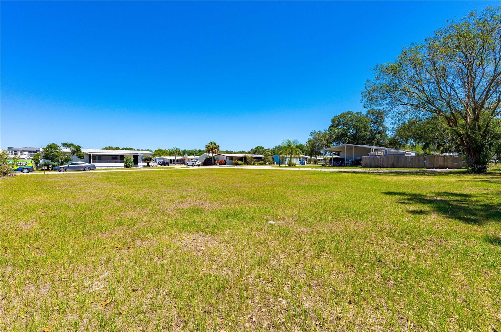 Looking for a pet friendly Florida 55+ retirement community? Are you looking to build in a prime location in Wesley Chapel? Come enjoy the sunshine! Exceptional location to build your retirement home or a winter get away place. You own the land in Terrace Park Estates 55+ community. The community offers pool, club house, shuffle, and much more! Low HOA community fee of $450/year. Investment property or a quiet place? All are available to you in this buildable lot on Chris Dr. in Wesley Chapel is zoned for ORMH. This vacant lot is 55' X 80'. LOT is CALLED PARCEL "A" IN SURVEY which is included in pictures. This community is deed restricted and second resident must be 45 or older. Call today!