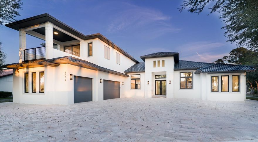 WAS $3,000,000 - NOW $2,699,000.  Introducing a rare NEW-CONSTRUCTION offering along the waters of Blackburn Bay in Nokomis.  2414 Bayshore Rd Sets a New Benchmark: The Gold Standard in New Construction.  From the moment you arrive, the home’s striking METAL TILE ROOF, steel impact-rated entry doors, and FULLY HURRICANE-RESISTANT construction set the tone for the level of quality found throughout.  Inside, the home’s soaring ceilings create an immediate sense of volume and grandeur.  The kitchen and baths are appointed with Taj Mahal Quartzite Counters.  The residence offers three expansive bedroom suites, each with its own ensuite bath, along with a stylish powder room for guests.  A private home office + separate bonus flex room provide the flexibility to create a theater, fitness studio, or retreat tailored to your lifestyle.  The home also features a dedicated sauna room to further enhance the home’s wellness-oriented design.  The Collectors' garage easily accommodates up to five vehicles, making it ideal for the discerning car enthusiast.  Welcome to Bayshore Rd - A Home Where You Can Truly Have It All.