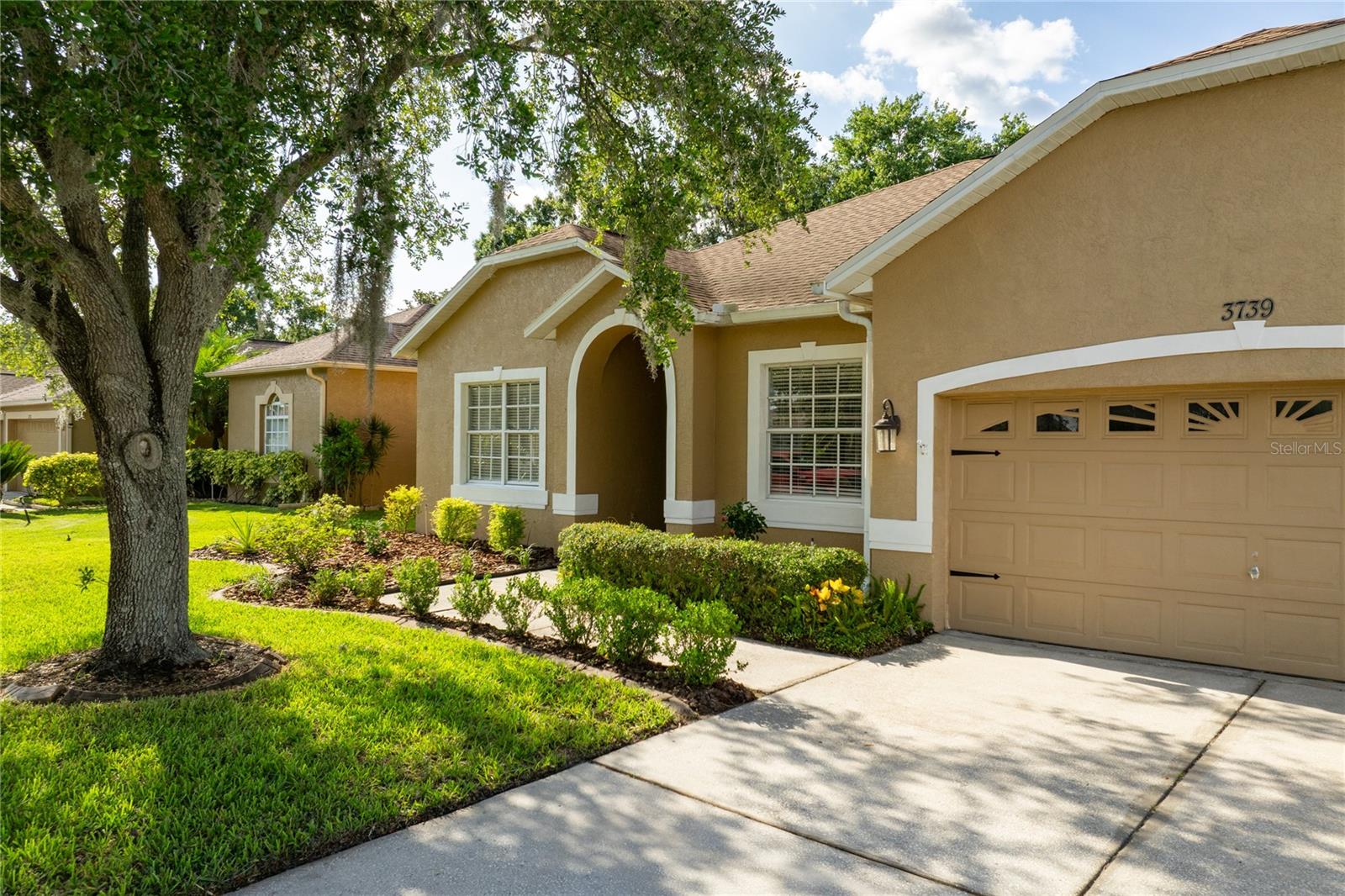 Welcome to 3739 Grand Forks Drive, a beautifully maintained 4-bedroom, 2-bathroom single family home located in the highly desirable Stagecoach community of Land O' Lakes, Florida. Offering 2,099 square feet of living space, this home features luxury vinyl flooring throughout, providing both durability and style. The kitchen and bathrooms are updated with sleek stone countertops, adding a touch of elegance to the functional layout. The spacious living areas flow seamlessly, making it ideal for both relaxing and entertaining. Step outside to a large, fully fenced backyard—perfect for pets, gatherings, or enjoying peaceful afternoons. Located on a quiet street, the property also includes a two-car garage for added convenience. Stagecoach is a welcoming neighborhood with amenities including a community pool, playground, and clubhouse. Just 5 minutes from the Tampa Premium Outlets and 7 minutes to I-75, this home offers easy access to shopping, dining, and commuting. Don’t miss this opportunity to live in a prime location with comfort, convenience, and community charm.