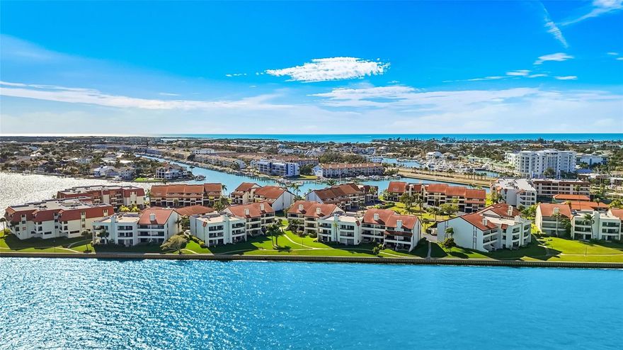 Freshly updated waterfront townhome — your island lifestyle starts here. This bright 3-bedroom + bonus room, 3.5-bath home offers water views from every room, each with its own balcony, plus a waterside patio designed for effortless indoor-outdoor living. The unit is priced without the boat slip; the purchase price including the private slip and 10K lift is $845,000. From the moment you walk in, you’re welcomed by an abundance of natural light and airy coastal finishes. Natural shades of tile in the entry and wood -looking luxury vinyl planks cover the living area, creating a seamless, clean aesthetic. A white tiled staircase leads to the main living level, where open sight lines reveal sparkling water views, a spacious living room with fireplace, balcony access, and a dining area that flows easily into the kitchen. The kitchen is both elegant and highly functional, featuring white solid wood cabinetry, lighter granite countertops, extensive prep space, and newer stainless steel appliances. Under-cabinet and ceiling accent lighting elevate the space and continue into the primary suite for a refined, custom feel. A hallway minibar enhances the island lifestyle. The laundry closet is located on the first level, and the first guest bedroom includes its own bathroom and private balcony with water views — reinforcing the rare feature that every bedroom enjoys its own outdoor space. Upstairs, a bright staircase leads to double French doors opening into the primary suite — a true retreat with soaring ceilings, stunning water views, a spacious and private balcony, a large walk-in closet, and an oversized, en-suite bathroom with a stand alone tub and walk-in shower. On the opposite side, the third bedroom offers double closets, an en-suite bath, and its own balcony overlooking the community with semi-water views, providing comfort and privacy for guests. The downstairs waterside patio offers a front-row seat to island mornings — the perfect place to enjoy coffee while watching dolphins and boats glide by, with easy access for you and your pet to step outside and enjoy the waterfront. The lower level also includes a spacious garage with extra storage and a flexible bonus room with mini-split AC and direct patio access. Currently used as an office and gym, this versatile space can easily adapt to hobbies, guests, or a man cave. Meticulously maintained and truly move-in ready, every detail reflects pride of ownership. The home is located within a 24/7 guard-gated waterfront community featuring a scenic waterside boardwalk, tennis courts, three heated pools, a club room, fitness center, and the convenience of an on-site HOA manager. The neighborhood is vibrant and active, positioned next to bike and walking trails, within easy walking distance to local restaurants, about 10 minutes to downtown St. Petersburg, and approximately 40 minutes to Tampa International Airport — blending island living with everyday convenience. This is waterfront living designed to be enjoyed — and best experienced in person.