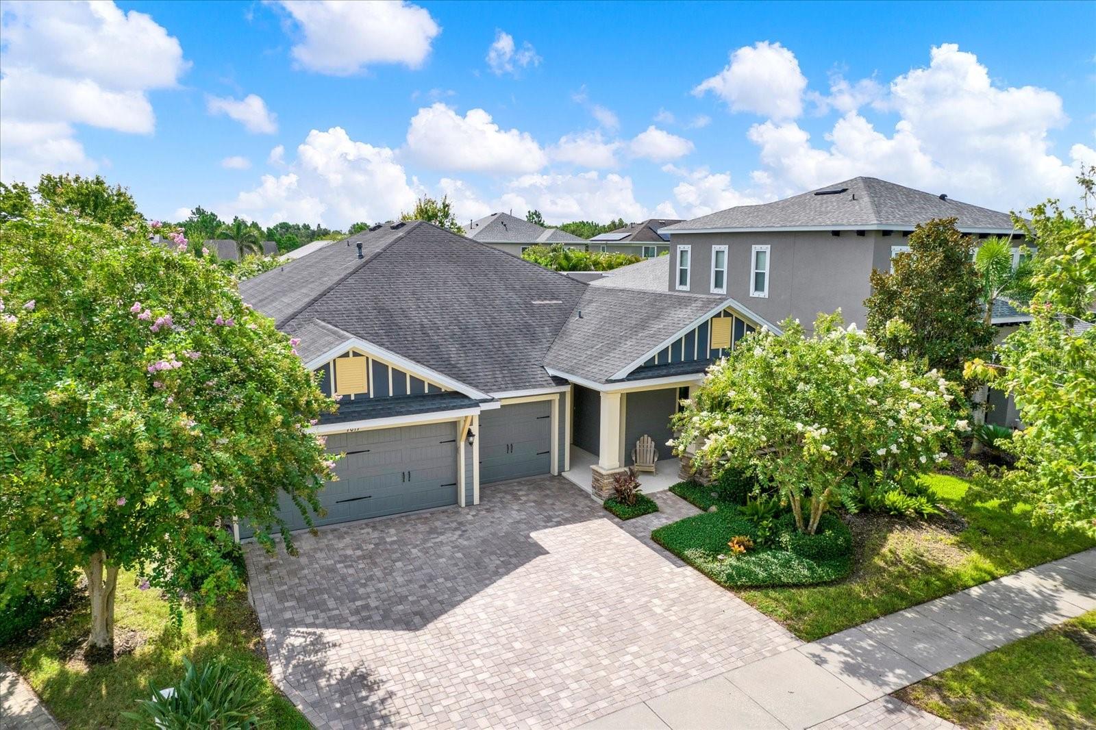 Discover refined living in this beautifully enhanced and generously sized residence in the highly regarded Waterset community of Apollo Beach. This David Weekley Kilbourne model sits on a prime lot with direct views of the neighborhood park, offering over 2900 square feet of well-designed space including four large bedrooms, three full bathrooms, a dedicated office or den, and a deep three-car garage. The kitchen is a chef’s dream, featuring 42-inch upper cabinetry, stainless steel appliances including a gas range and new refrigerator, an expansive walk-in pantry, granite counters, a butler’s pantry, and a built-in desk. The open-concept living spaces are elevated by wide plank laminate flooring, plantation shutters throughout, crown molding, tray ceilings, and custom wall treatments. Entertainment is effortless with built-in surround sound throughout the home, front and rear porches, and even the garage. Thoughtful details like the tongue-and-groove ceilings on the porch and lanai, and a spacious fenced backyard, add character and charm. The owner's suite features a bay window sitting area, a large bath with garden tub and walk-in shower, and an oversized closet. Guest rooms are equally spacious and well-appointed. Built in 2014, this meticulously maintained home feels better than new and is move-in ready. Residents of Waterset enjoy an exceptional lifestyle with access to multiple pools, fitness centers, trails, parks, sport courts, a café, and a vibrant neighborhood atmosphere ideal for families and anyone seeking community connection.