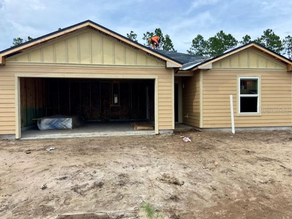 Photo of 122 Hulett Woods Road S, Palm Coast, FL 32137 (MLS # FC301737)