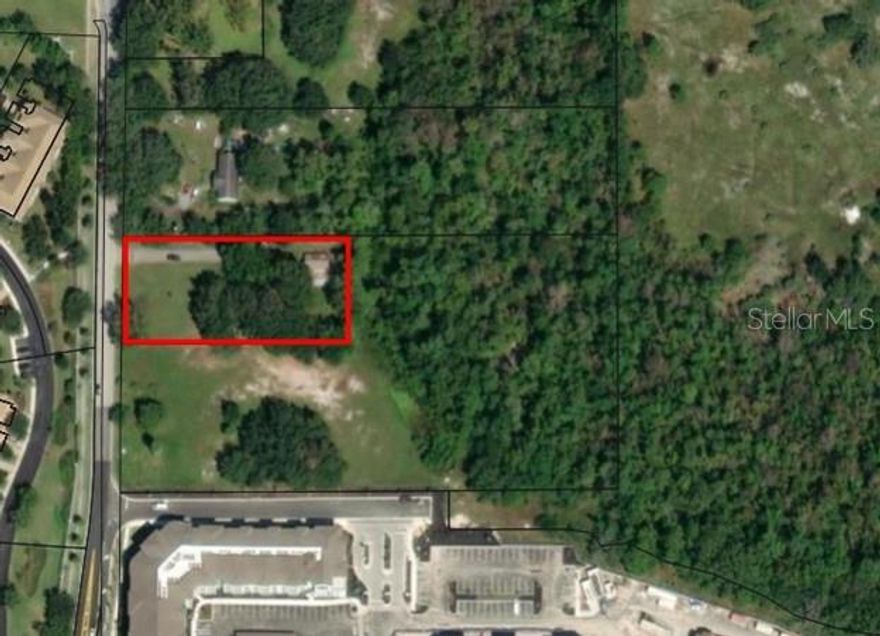 This strategically located property is directly across from ChampionsGate. The value is in the land with 140' frontage on Goodman Road near the corner of Goodman and Bella Citta Blvd. however the 1,312 sf residence is in excellent condition with potential use as a rental property or full conversion to commercial or office. This property is being marketed with the two adjacent properties (MLS#R4902521 & MLS#R4907180) for a total of 7.5+/- acres. New developments in the area include the Academir Charter School to the north and the Cortland at ChampionsGate apartments. The planned Sinclair Road Extension project is designed to connect Sinclair Road to Bella Citta Blvd. and will be a new connection between SR 429 and US 27.