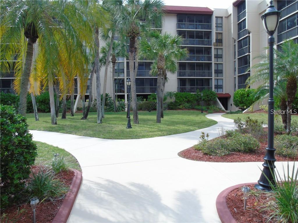 Welcome to Promenades East! Conveniently located in the heart of the area, this vibrant condominium community has something for everyone. Quick access to restaurants, shopping, bowling, and beaches will allow you to make the most of your time in Florida. Even more importantly, this condo has exceptionally close proximity to the some of the most decorated doctors and hospitals in Port Charlotte. Rest assured with all of your exterior yard maintenance taken care of. Instead, take a stroll through the community courtyard and kitchen accessible clubhouse leading to the oversized Promenades pool to soak up the sun. The condo is adorned with bright, warm, natural light cascading through oversized sliding glass doors and windows overlooking the private courtyard below. Enjoy your private balcony year around with ideal sun orientation. Stunning oversized, wood-tile plank tiles sweep throughout the entire condo. Rest assured, your car will stay clean in cool in your assigned covered parking space, conveniently located right next to private community storage area. Enjoy the comforts of inside laundry, extra kitchen counter space, two private bathrooms, and still have remaining space to entertain comfortably. The peaceful setting of Promenades East combined with the ideal orientation of this property, create a very private feeling atmosphere in your own little oasis.