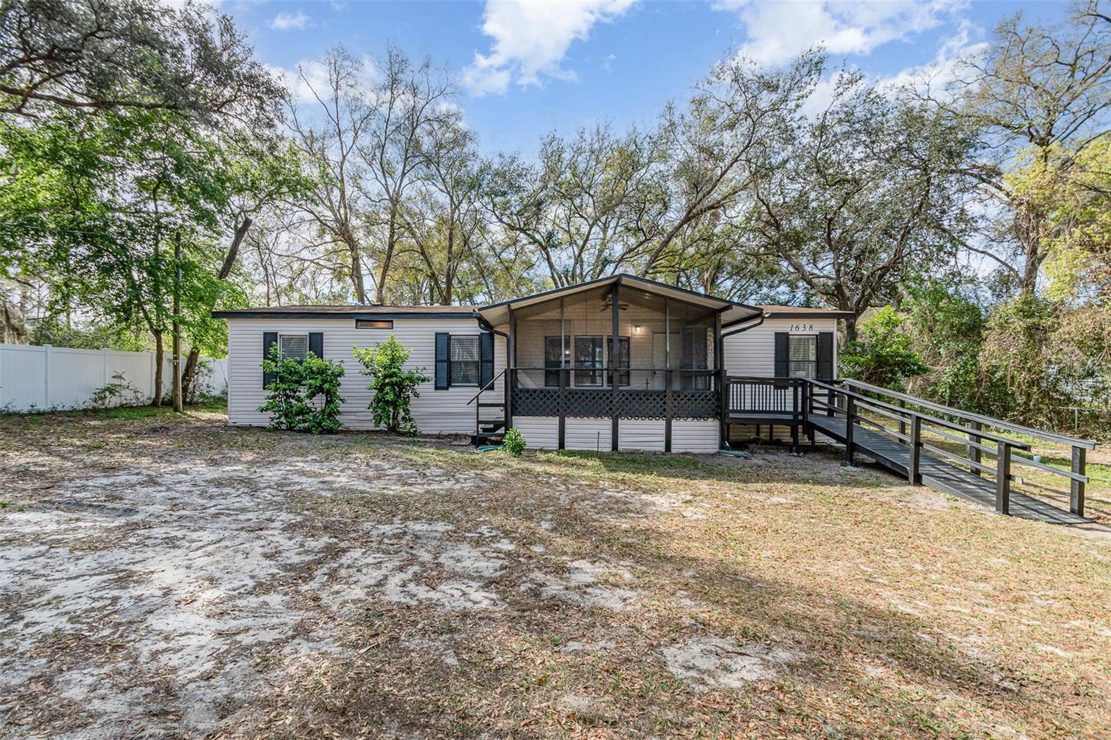 Priced to Sell and Move-In-Ready! Accepting FHA and VA offers. 3 Bedroom | 2 Bathroom | 1404 Square feet | 1638 Leesburg Blvd in Fruitland Park is ready for its new owners and can close quickly! This beautifully updated home sits on a 1/3 acre lot and features screened-in front and back porches, perfect for enjoying the Florida weather. Step inside to discover an open floor plan, lots of natural light and the many updates. The split floor plan offers three bedrooms, two updated bathrooms, and an inside laundry room. You'll also find both a living room and a family room with a cozy fireplace. The kitchen has been completely remodeled and includes all new appliances, new cabinets and countertops. Additional updates throughout the home include new flooring, light fixtures, and interior paint. Roof in 2016. The spacious primary bedroom boasts an en-suite bathroom and a walk-in closet. Bedrooms two and three each have ceiling fans and built in closets. This is a must see...Welcome home! All information recorded in the MLS is intended to be accurate however, it should be independently verified by buyer and their agent.