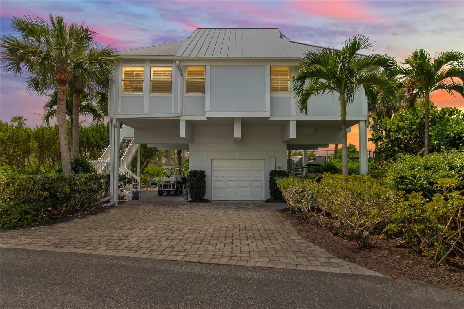 The most land and view at the very best price! The largest lot and yard of any of the 55 Village Homes, beautifully remodeled and updated through the years. All corners of the Home have been enclosed and have standing seam metal roofing. Hardwood flooring throughout excepting guest bedrooms and bunk room with new, just installed carpet. The Corner location overlooking the Tennis Courts is spectacular with exceptional views and unfiltered natural light. The enlarged Living Room and Master Bedroom with enclosed porches/corners add an enchanting Overlook and added space with Closets and additional Office desk space too! Silestone and Marble countertops, new SS Fridge and Microwave, high ceilings with updated lighting are just a few of the modern improvements.