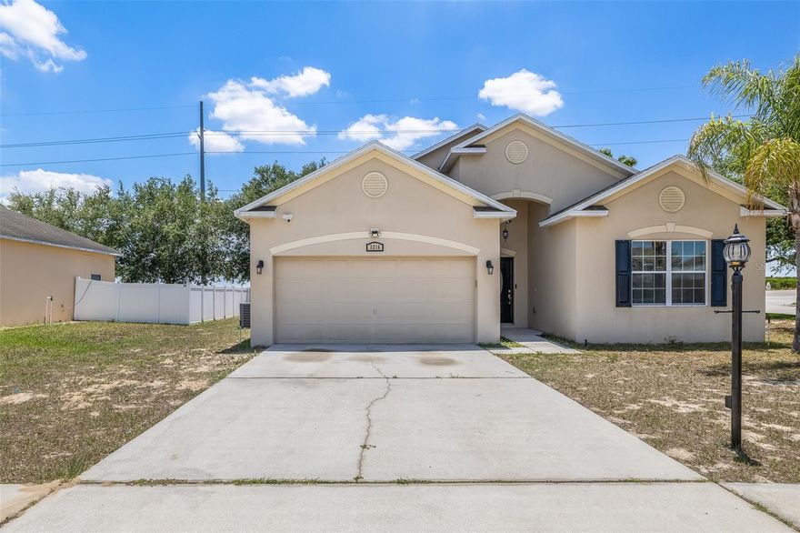 BACK ON MARKET. Welcome to this stunning. tranquil corner-lot home! This well-kept 4-bedroom, 2-bath property with a 2-car garage, offers 1,855 sq. ft. of comfortable living space designed for both everyday living and entertaining. As you enter, you’ll immediately notice the open layout connecting the living room, dining area, and kitchen—giving you a spacious feel . The kitchen features a convenient breakfast bar, with updated ceiling fans throughout the home adding a nice modern touch. The primary suite offers a private retreat with its own en-suite bathroom, complete with a soaking tub and separate shower—perfect for relaxing after a rough day. Step outside to a large screened lanai, ideal for year-round entertaining or just hanging out. Situated on a corner lot near the Lake Eva Community Park,Idealy situated from nearby shopping, dining, and major attractions like Disney and Tampa. This is your opportunity to own this beautiful home in Dundee, Florida