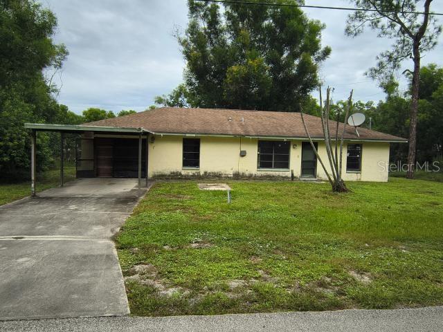 Photo of 3803 E 2nd Street, Lehigh Acres, FL 33936 (MLS # TB8547279)