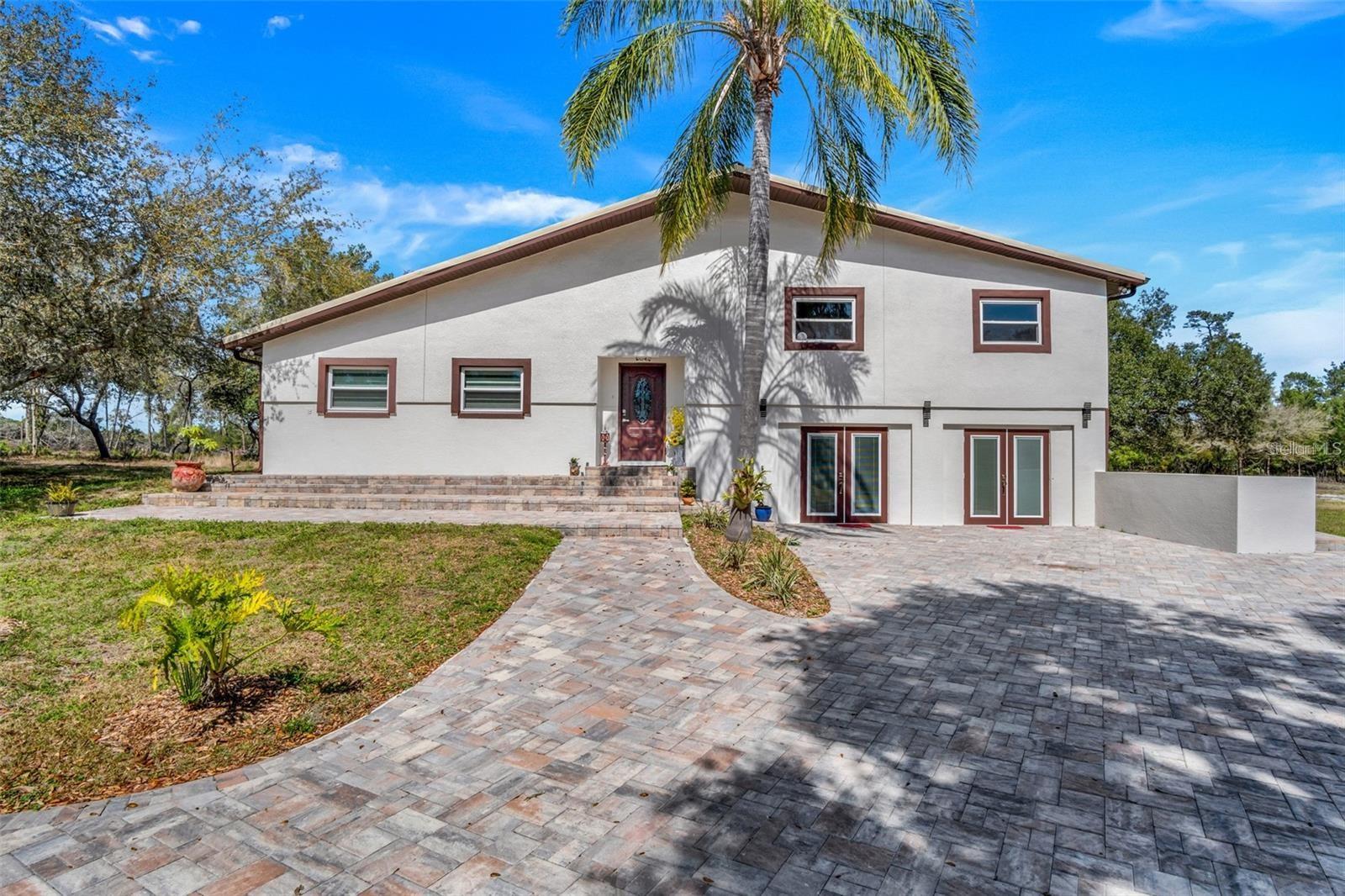 Are you looking for that special place where you can call home but get to escape from the noisy world? This private oasis is perfectly nestled within Florida's natural habitat. Enjoy the expansive 10 acres with plenty of room to experience quiet life all on your own. Beautiful home and guest house, sitting on 10 acres. This property is fully fenced and there is room for the whole family and a separate 900 sf modular unit for mom or guests is just one of the magnificent details on this beautiful home. This home is very strong and ALL renovated from top to bottom and is ready for its new owner. Extreme privacy with your high and dry 10 acre square parcel. You are conveniently located and have a Eustis address but you are about 20 miles east of Eustis and 8 miles off of 44 Deland area. Only a 45 min drive to the Beaches and about 1 hour drive to Orlando. Not too far from shopping or restaurants and medical facilities. Call today for your private showing so that you may own a piece of your country paradise for an amazing price!!Bring the horses, 4-wheelers, boat, RV or any other item you need the extra room for, great living space with endless possibilities. Several bonus rooms to create what ever extra type of living space you are looking for. Remodeled Kitchen, new porcelain tile flooring, cleaned, and new paint. New Shingle roof and new AC. Fenced area for horses or other animals, small barn and 25x40 huge Metal Shop with two roll up bay doors . Carport and an additional 900 square foot modular unit is perfect for additional living space or an office, workshop, craft room or anything else you need it to be which includes a full bathroom, 3 bedrooms and kitchen area. The choices are all yours! All measurements and info are deemed to be correct but not guaranteed. What more could you possibly ask for?! Call your realtor today for a private tour of this amazing home!