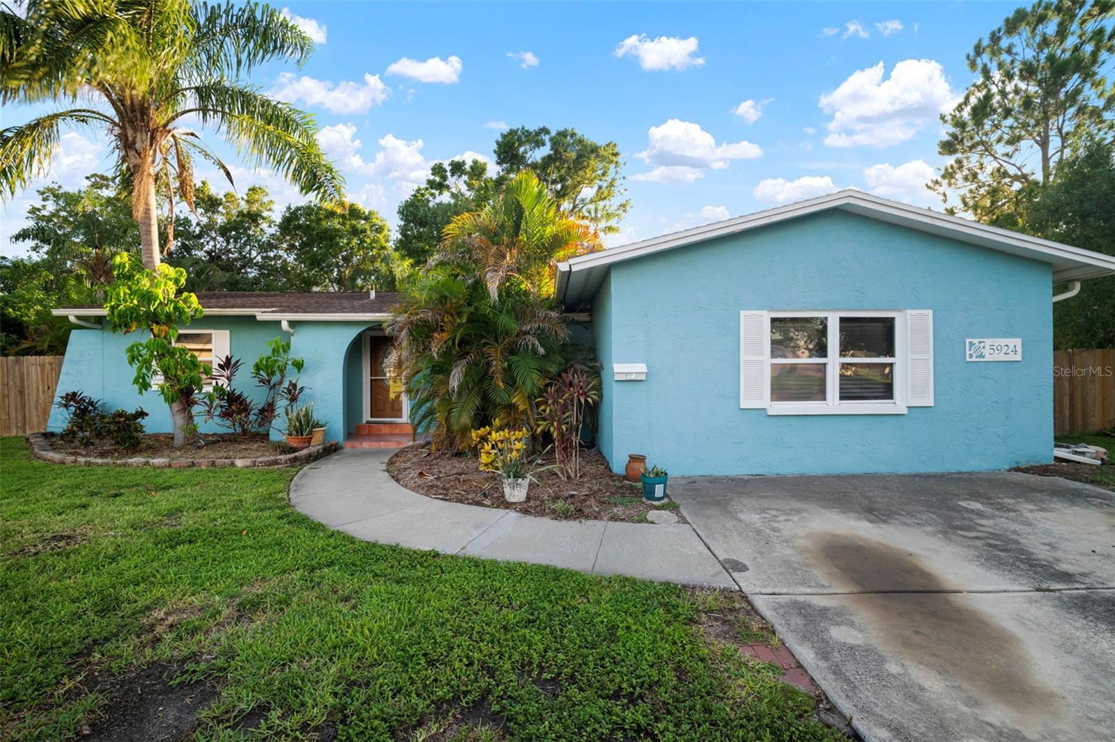 One or more photo(s) has been virtually staged. Welcome to Shore Acres, where this 3-bedroom, 2-bathroom pool home offers comfort, space, and one of the best backyards in the neighborhood. Situated on a generous .42-acre lot with no rear neighbors, this property provides both privacy and incredible outdoor living potential. The fenced yard is perfect for gatherings, gardening, play areas, or even room to add a garage, Pickleball Court, or boat parking. Mature landscaping surrounds the sparkling in-ground pool, creating a private retreat right at home.
Inside, the split-bedroom floor plan offers a master suite with walk-in closet and private bath on one side, and two additional bedrooms with a hall bath on the other. Multiple living spaces include a living room, a separate family room, and a dining area that opens to the pool through sliding glass doors. The kitchen features a pass-through breakfast bar, making it easy to stay connected while entertaining. A spacious laundry room with side yard access adds convenience and storage.
This home is ready to enjoy now, with the flexibility to personalize over time. With its solid construction, great bones, and an unbeatable lot, it’s a wonderful opportunity to make your own mark while enjoying the highly desirable Shore Acres lifestyle. Just minutes from Denver Park, Mangrove Golf Course, and Northeast Little League Park—and a short drive to downtown St. Petersburg—this is the place to create your perfect Florida home.
