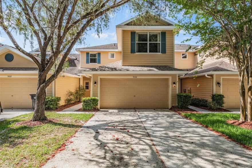 One or more photo(s) has been virtually staged. MOVE-IN READY 3-BEDROOM TOWNHOME WITH OPEN FLOORPLAN IN GATED COMMUNITY WITH POND VIEWS AND RESORT-STYLE AMENITIES — Welcome to this well-maintained townhome offering the perfect blend of comfort, style, and low-maintenance living in highly desirable New Tampa.  Residents enjoy access to a beautiful clubhouse, resort-style pools, splash pads and kiddie pool area, huge fitness center, a putting green and driving cages, and tons of activities—creating a true lifestyle experience right at home.  Inside, you’ll find an open floorplan with high ceilings and abundant natural light, enhanced by two sliding glass doors that lead to a private rear patio overlooking a peaceful pond.  The main living area features newer luxury vinyl plank flooring, along with a spacious living and dining area complete with ceiling fans for added comfort.  The kitchen is equipped with newer stainless-steel appliances, ample cabinetry, and a convenient breakfast bar that opens to the main living space—ideal for both everyday living and entertaining.  This well-maintained home features newer flooring on the main level and offers tranquil pond views from the backyard.  The private rear patio creates a perfect space to relax, unwind, or enjoy the outdoors.  All three bedrooms are located upstairs, including a spacious primary suite featuring a walk-in closet, dual sink vanity, and a glass step-in shower.  Two additional bedrooms are generously sized with large closets and share a well-appointed full bathroom, providing flexibility for family, guests, or a home office setup.  Ideally located near shopping, dining, local schools and major roadways, this home offers low-maintenance living in a well-maintained, gated community with outstanding amenities.