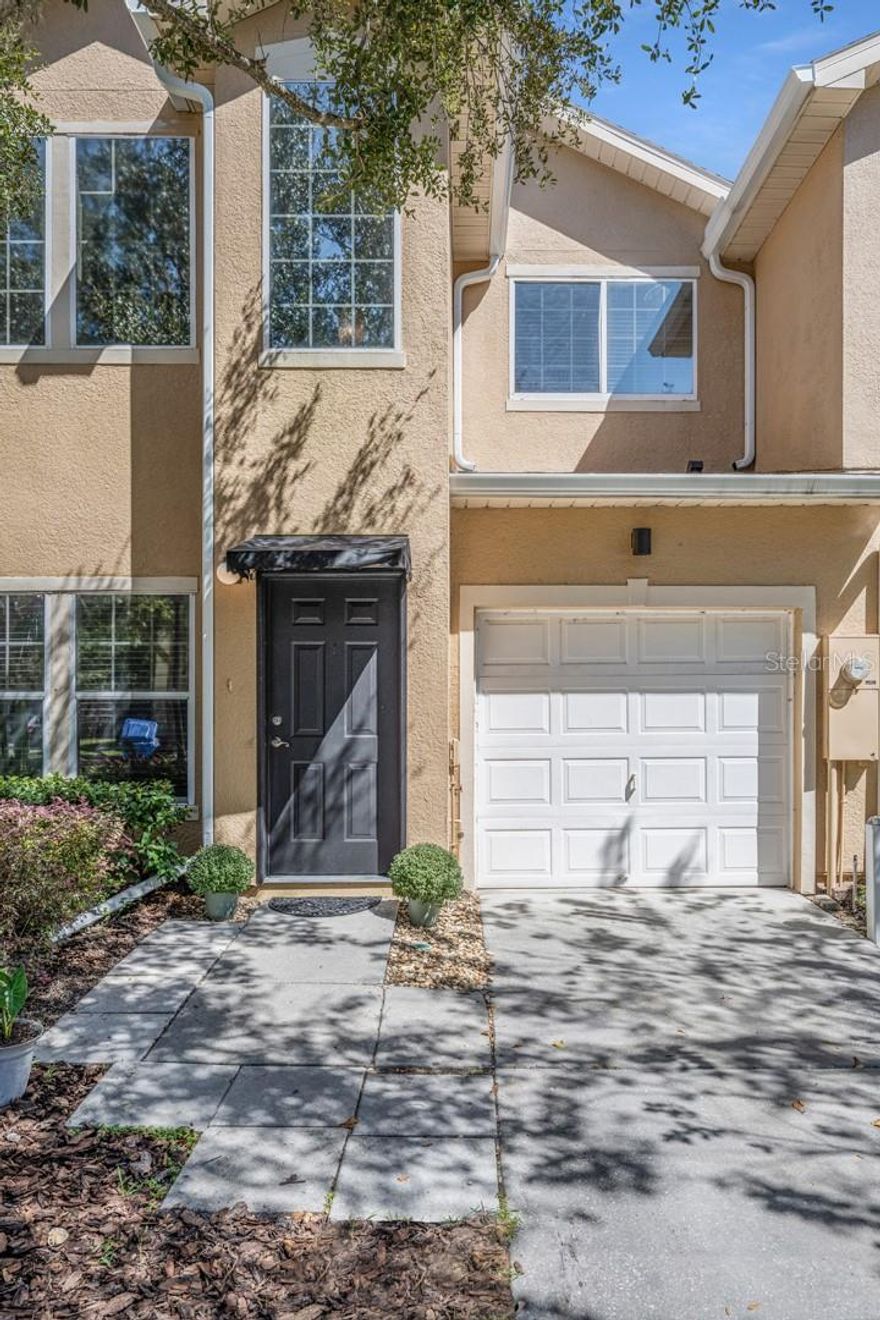 Get excited- finally a 3-bed, 2.5-bath townhome in gated Tampa Palms is available; this kind of home doesn’t come around often enough! Nearly remodeled top to bottom, this new owner can enjoy the buying process as TLC has already been added to make sure this home is the right fit. A clean palate to create your own, the entire interior has been painted top to bottom (even the garage!). Brand-new LVP flooring throughout the main level welcomes you from front door to family room to kitchen where the look is competed with never cooked on Quartz countertops and bright new cabinets. It's clean, stylish, and totally move-in ready. The laundry room and half bath contribute to the main living space, as well as the screened-in patio leading through the slider door in the family room.
Major walk-in closets accompany both bedrooms, along with the upstairs complete with new carpet and the same Quartz countertops in both bathrooms. Add in your own private mailbox, a community pool, and a low HOA of just $220/month, and you've got a home that’s as practical as it is pretty.
And yes—this one’s in the Tampa Palms school trifecta: Tampa Palms Elementary, Liberty Middle, and Freedom High.
Whether you're upsizing, downsizing, or just looking for something that finally feels right, this home brings the space, style, and amenities you've been waiting for.