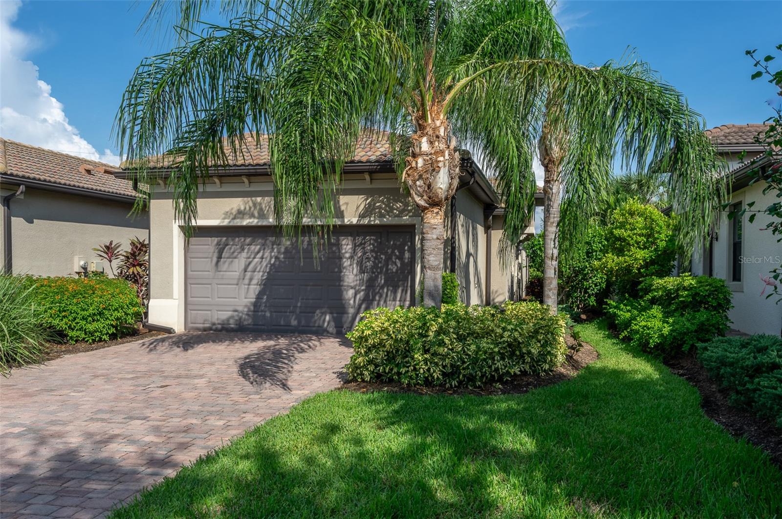 Paradise Awaits: Resort-Style Living in Palmer Ranch!
Move in today and wake up in Paradise tomorrow! This stunning 2-bedroom, 2-full bath, with bonus room paired villa in the gated community of Hammock Preserve offers the ultimate Florida lifestyle, free from maintenance fees and CDD burdens. Imagine coffee on your screened lanai, overlooking the serene lake view while the sun rises streaming through the 8-foot doors and sliders, creating a bright and airy haven.
This meticulously maintained home boasts porcelain tile throughout, a neutral color palette, designer lighting for a modern feel, and a gorgeous gourmet kitchen with stainless steel appliances, quartz countertops, and marble backsplash. The bonus room with a closet-ready niche provides extra space and flexibility to fit your lifestyle priorities. Peace of mind upgrades include whole-house water filtration system, infrared HVAC filters for cleaner air, 2-car garage with Epoxy flooring and Hurricane-ready with Impact entry door and whole- house hurricane shutters for the windows.
The Hammock Preserve gated community includes a Catering Club House for unforgettable gatherings, Pickleball and Tennis courts for friendly competition, sparkling resort-style pool and spa for relaxation and recreation, Fitness Center, Dog Park for your furry friend and on-site Property Manager for your convenience. Located in the heart of Sarasota County, with easy access to Downtown Sarasota cultural centers, the quaint Downtown Venice center, Siesta Key Beach and the 20-mile Legacy Trail for biking/walking while experiencing the lush tropical Florida landscaping.
Ready to trade in your worries for paradise? This move-in ready 2017-built home is waiting for you!