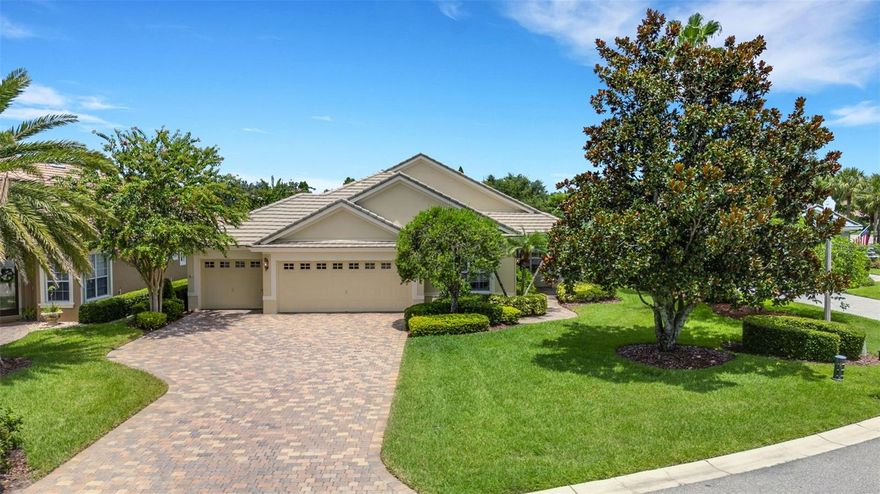 PRICE IMPROVEMENT on this stunning Ascot model home in Bellerive featuring nearly 2,700 sq ft of living area with hardwood and tile flooring throughout.  The open great-room floor plan includes 3 bedrooms, 2.5 bathrooms, a dedicated office/study, and a formal dining room.  Built in 2005 and meticulously maintained, this beautiful home is centrally located within Grasslands Golf & Country Club, and close to swimming, tennis, and pickleball facilities.  Upgrades include a tile roof, solid wood cabinetry, granite counter tops, GE Profile and Monogram series appliances, extensive crown molding, wainscotting, brick paver driveway, walkways and back porch plus an oversized 3-car garage.  Recent improvements include interior repainting in neutral tones to complement any décor, PGT sliding glass doors that offer peaceful long-range views of the water, new Pella entry door with multi-point lock system, completely replaced Trane HVAC systems and ductwork in 2019, and 80-gallon hot water heater in 2022. Centrally located behind the 24/7 staffed gates of the Grasslands Golf & Country Club you have access to so much!  Minutes to shopping, dining, medical facilities and other community owned recreational venues, downtown Lakeland and major transportation corridors. This home is absolutely in turn-key condition and ready for its next chapter.  Discover for yourself the mystique of Bellerive and why it has the reputation as the most “coveted” address inside Grasslands.  Shown by appointment only.