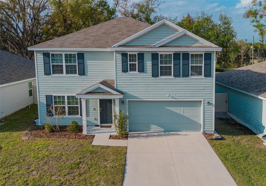 Welcome to this better-than-new 2022-built 5-bedroom, 3-bathroom home in the established Oak Park community of Newberry, Florida, offering over 2,500 square feet of bright, open living space without the construction noise, delays, or unfinished surroundings found in nearby new builds. From the moment you walk in, you’ll notice the abundance of natural light and the easy flow of the open-concept layout, where the kitchen overlooks the living and dining areas—perfect for everyday living and entertaining. The kitchen features granite countertops, a large walk-in pantry, and stainless-steel appliances including a refrigerator, electric range, microwave, and built-in dishwasher. The first floor also includes a flexible room ideal for a home office, playroom, or gym, along with a bedroom and full bathroom—perfect for guests or added privacy. Even more enticing, SOME FURNITURE IS NEGOTIABLE! Step outside to a patio and a large, fully fenced backyard already in place, ready for pets, play, or your future vision with space for a pool, fire pit, or outdoor entertaining area. Upstairs, the spacious owner’s suite offers a relaxing retreat, while three additional bedrooms are centered around a second living area that makes a great media room or hangout space, along with a third full bathroom and a laundry room with washer and dryer for added convenience. What truly sets this home apart is the lifestyle and value, with a location that allows you to walk to the brand-new Publix and be just minutes from Easton Sports Complex, downtown Newberry, and Country Way Town Square, plus an easy commute to Gainesville—grab groceries, head to practice, or commute into Gainesville with ease. As a resale home, many of the details are already in place, helping you avoid the typical first-year expenses like window treatments and outdoor fixtures, as well as the inconvenience of handling early warranty repairs often experienced with new construction. Add in lower utility costs with City of Newberry services and very low HOA fees, and you have a home that offers both comfort and long-term value. Qualifies for a 0% down USDA loan.