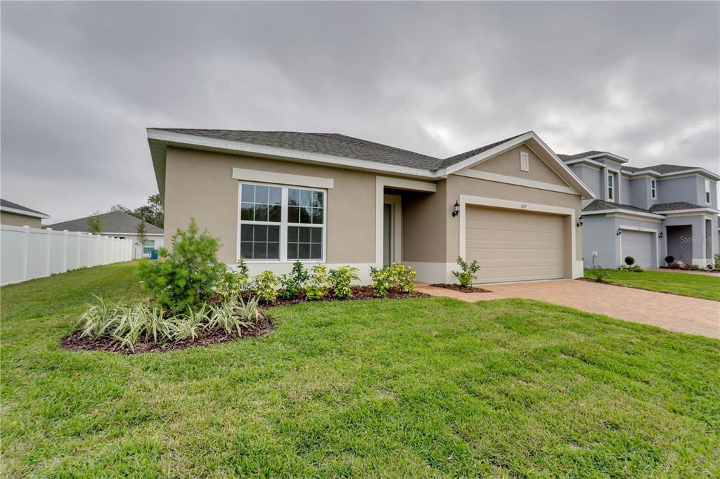 Photo of 829 Avenal Lane, Davenport, FL 33837 (MLS # O6355269)
