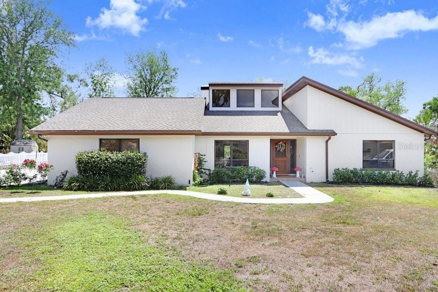 Tucked away in one of Brandon’s most distinctive neighborhoods, this one-of-a-kind property offers character, space, and privacy rarely found in today’s newer construction communities. Situated on an expansive .80-acre lot, the setting is defined by rolling terrain, towering oak trees, and a collection of architecturally unique homes—a refreshing departure from cookie-cutter design. Inside, the home welcomes you with soaring ceilings and a light-filled great room, where oversized windows bring the outdoors in. Rich details such as real wood doors and natural, unpainted trim create warmth and timeless appeal reminiscent of classic Midwestern craftsmanship. Multiple outdoor living spaces—including a screened porch, open deck, and sprawling yard—offer endless opportunities for relaxation and entertaining. A large concrete driveway and side-load garage provide both convenience and excellent access to the property. The home has been freshly painted and is surrounded by a PVC fence that maintains open sightlines, allowing you to enjoy the beauty of the lot without feeling enclosed. If you’ve been searching for space, character, and a neighborhood with personality—this is the one.