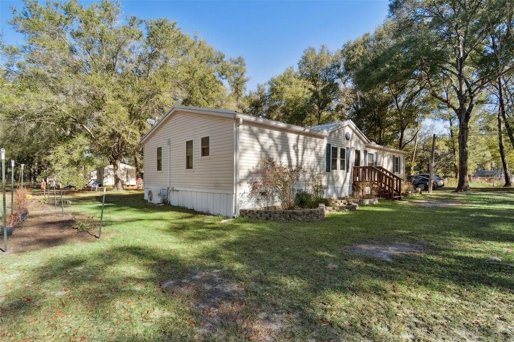 Photo of 10931 NE 95th St, Archer, FL 32618 (MLS # OM715476)