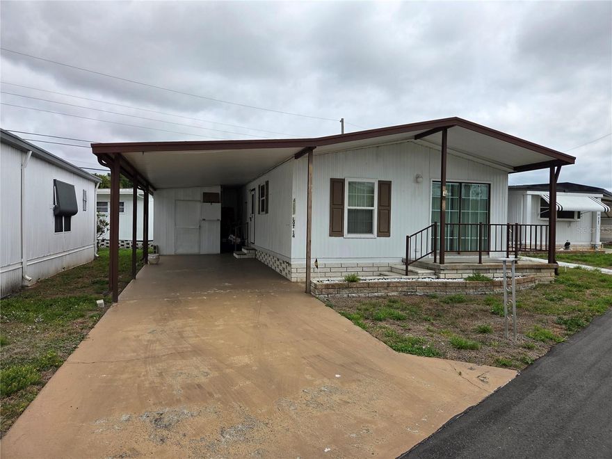 This 2 bed 2 bath home is located in Magnolia Manor a 55+ Community.  The home has a central AC system with heat pump, carport, front porch & a storage shed (with washer & dryer). The interior of the home comes fully furnished & has been updated with newer kitchen cabinets, laminate countertops, newer energy efficient windows, bathroom vanities, shower stalls & toliets. Community amenities include: Clubhouse, Library, Fitness Center, Swimming Pool, Laundry Room & Shuffleboard Court.  The HOA fee is $225 which includes water, sewer, trash & landscaping.