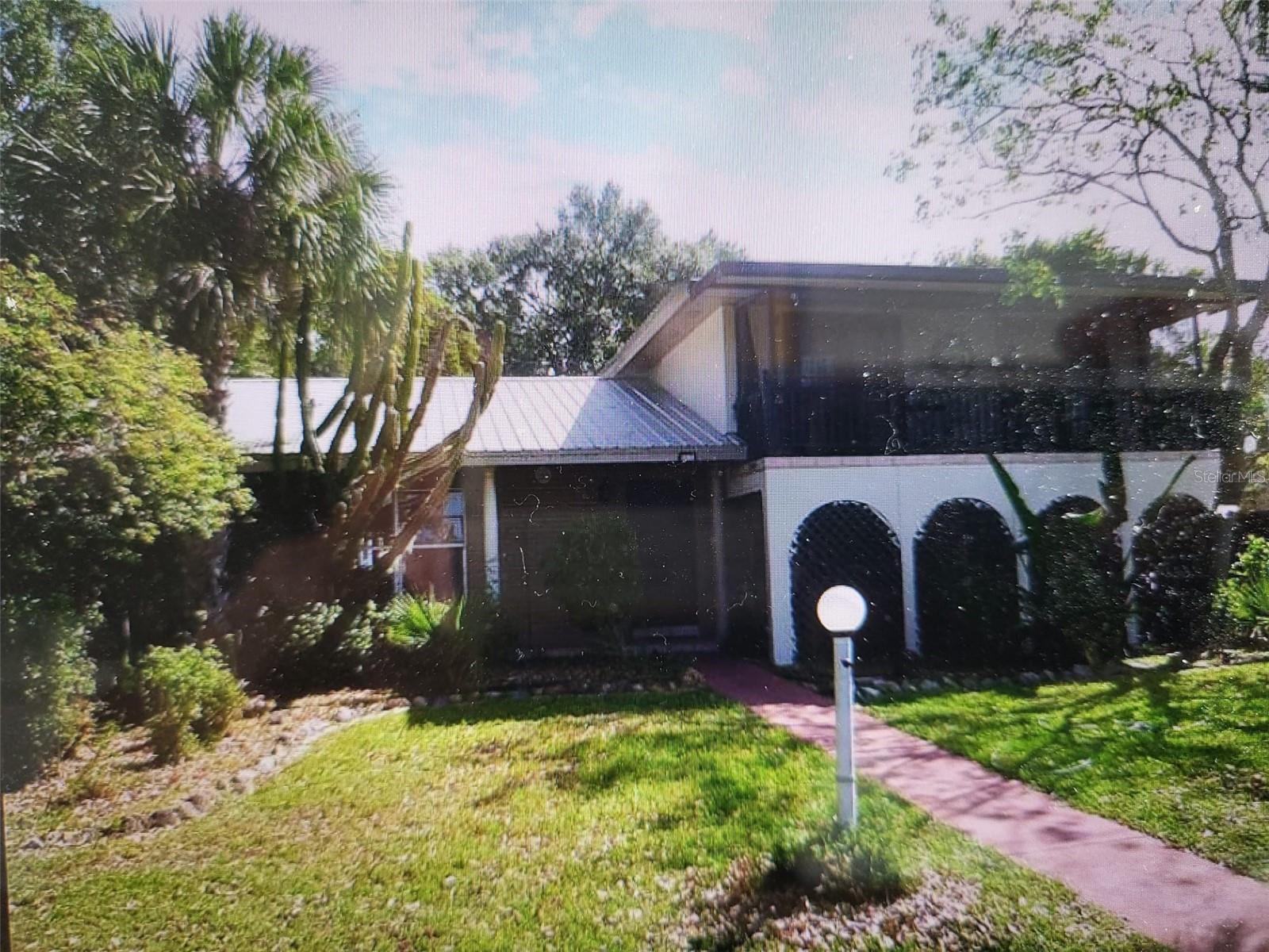 Under contract-accepting backup offers. Beautiful lake view property with private boat ramp on highly desirable Lake Gibson. With some TLC & updating, this could be your dream lakefront home with swimming pool in the back. House sits on a huge 13,000 square foot lot with 3,108 heated sq ft with a total of 4,500 sq ft area under a lifetime metal roof. The main house is a 2 story 4 bedroom 2 bath home with an attached 2 bedroom 1 bath mother-in-law apartment (which can be potentially used as an income property as Airbnb). Yes, the house needs some work, but with some repairs, this can be made a turnkey home for you. Great location to I-4 and all closeby shopping areas. The listing is AS IS, WHERE IS & HOW IS, price is net-to-seller (buyer pays ALL closing costs).