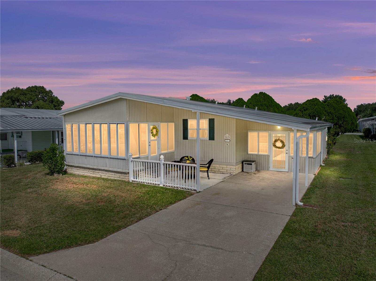 Enjoy the active Florida lifestyle in this beautifully updated home set in the desirable 55+
community of Colony Hills, where you own the land and have access to fantastic amenities
including a pool, spa, clubhouse, tennis court, and shuffleboard! Offering over 1,300 sq ft of
living space and a 2020 roof, this furnished home is turn-key and filled with thoughtful upgrades.
An inviting exterior welcomes you with a covered front patio and a one-car carport. Step inside
to a heated and cooled bonus room complete with access to a laundry room/workshop and a large
storage closet. The updated kitchen is absolutely stunning with shining stainless steel appliances,
wood-look countertops, a decorative backsplash accent above the range, freshly painted
cabinetry with new hardware, and crown molding that flows into the dining area featuring an
updated buffet bar, charming paneling details, and an elegant chandelier. Luxury vinyl plank
flooring continues into the bright and airy living room with vaulted ceilings and sliding doors
that lead to a heated and cooled Florida room, perfect for a second living area, office, or craft
room. The primary suite is a peaceful light filled retreat with a walk-in closet and a fully updated
bathroom showcasing a new vanity, mirror, matte black fixtures, and a walk-in shower. A
spacious second bedroom sits near another fully renovated bathroom with matching updates,
offering comfort and style for your guests. Charming, updated, and designed for easy living, this
home is a wonderful opportunity in a vibrant community. Call today to schedule your private
showing!